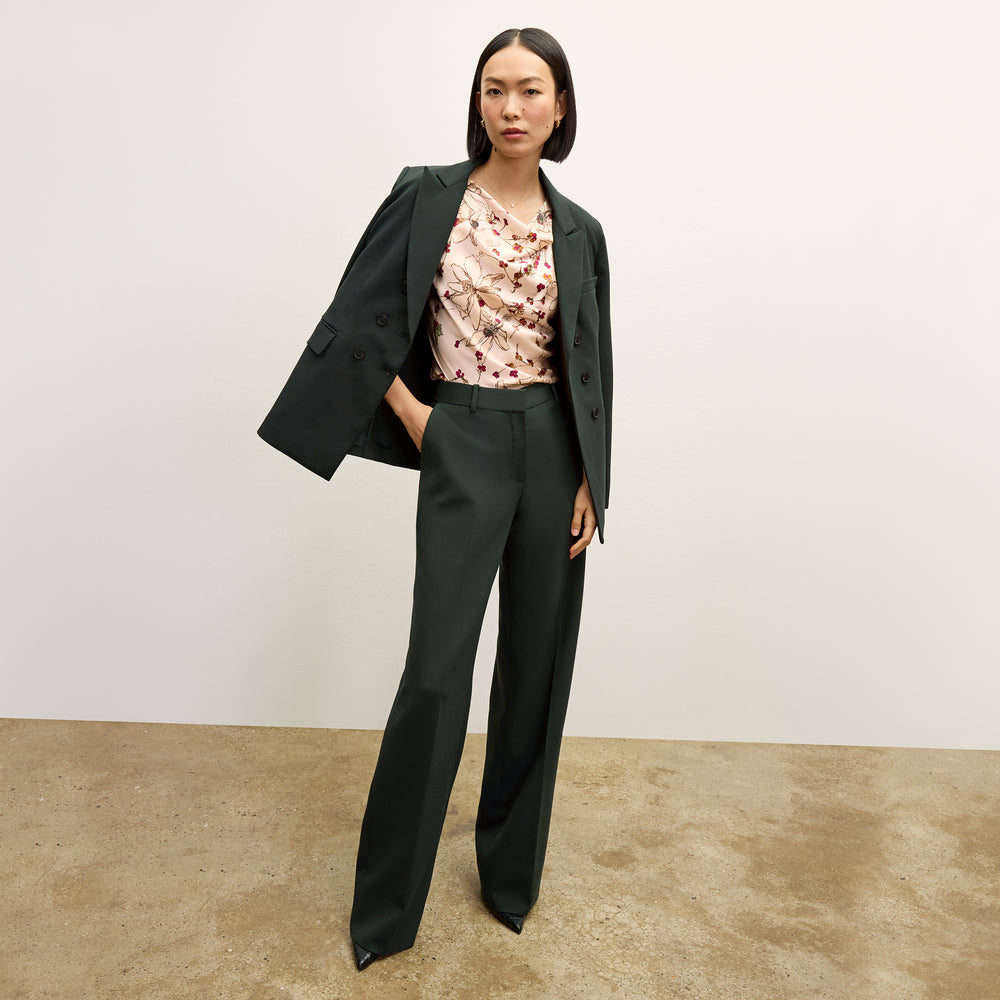 front image of a woman wearing the kati jacket in dark emerald