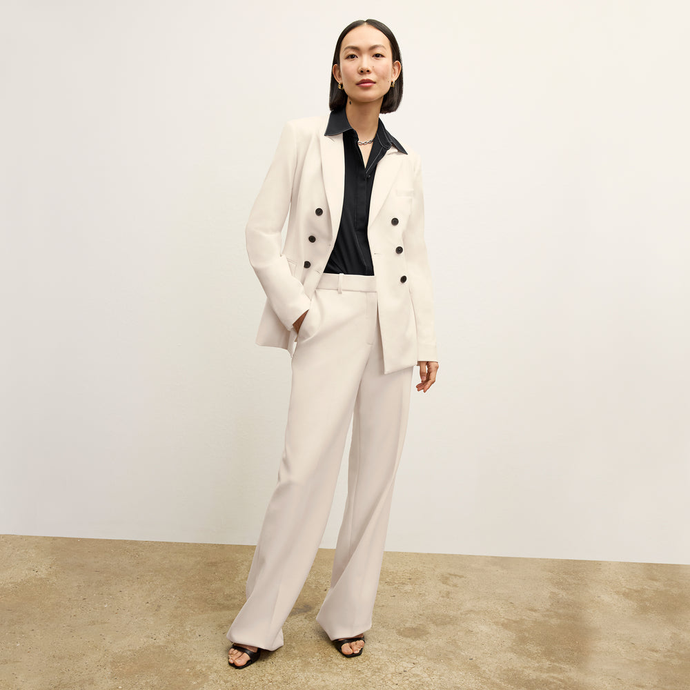 front image of a woman wearing the tinsley pant ivory
