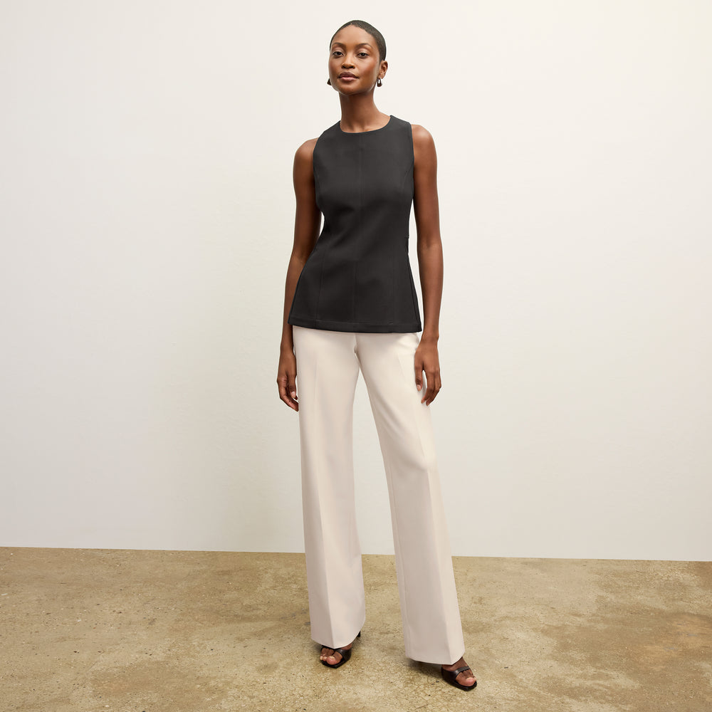front image of a woman wearing the lucia top in black
