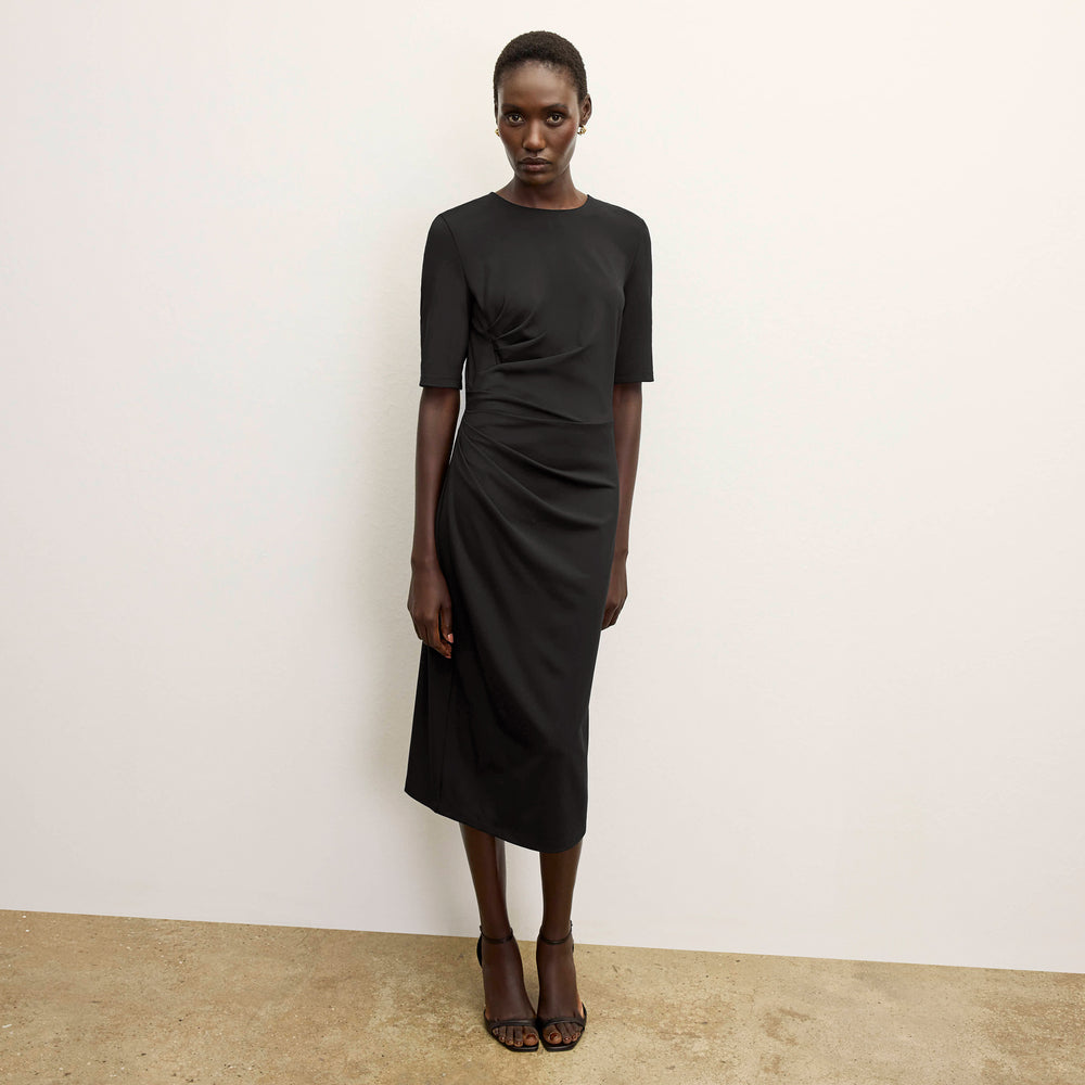 front image of a woman wearing the ciela dress in black