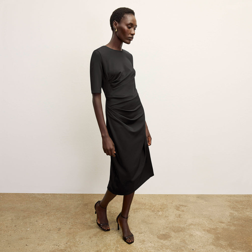 front image of a woman wearing the ciela dress in black