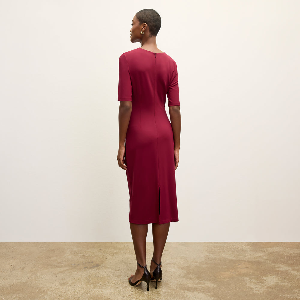 back image of a woman wearing the ciela dress in grenache