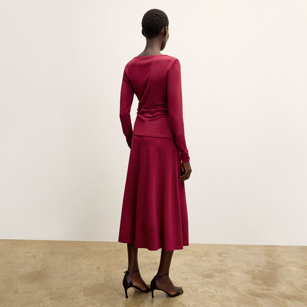 back image of a woman wearing the percy top in grenache