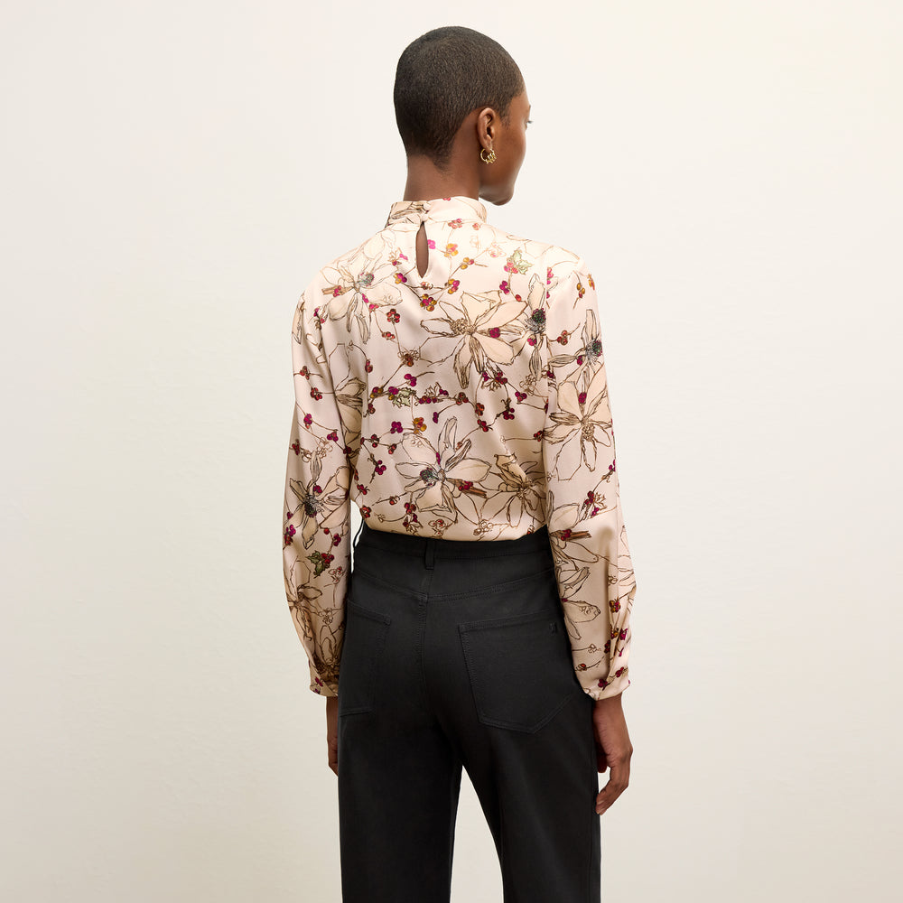 back image of a woman wearing the sohee top in botanical print