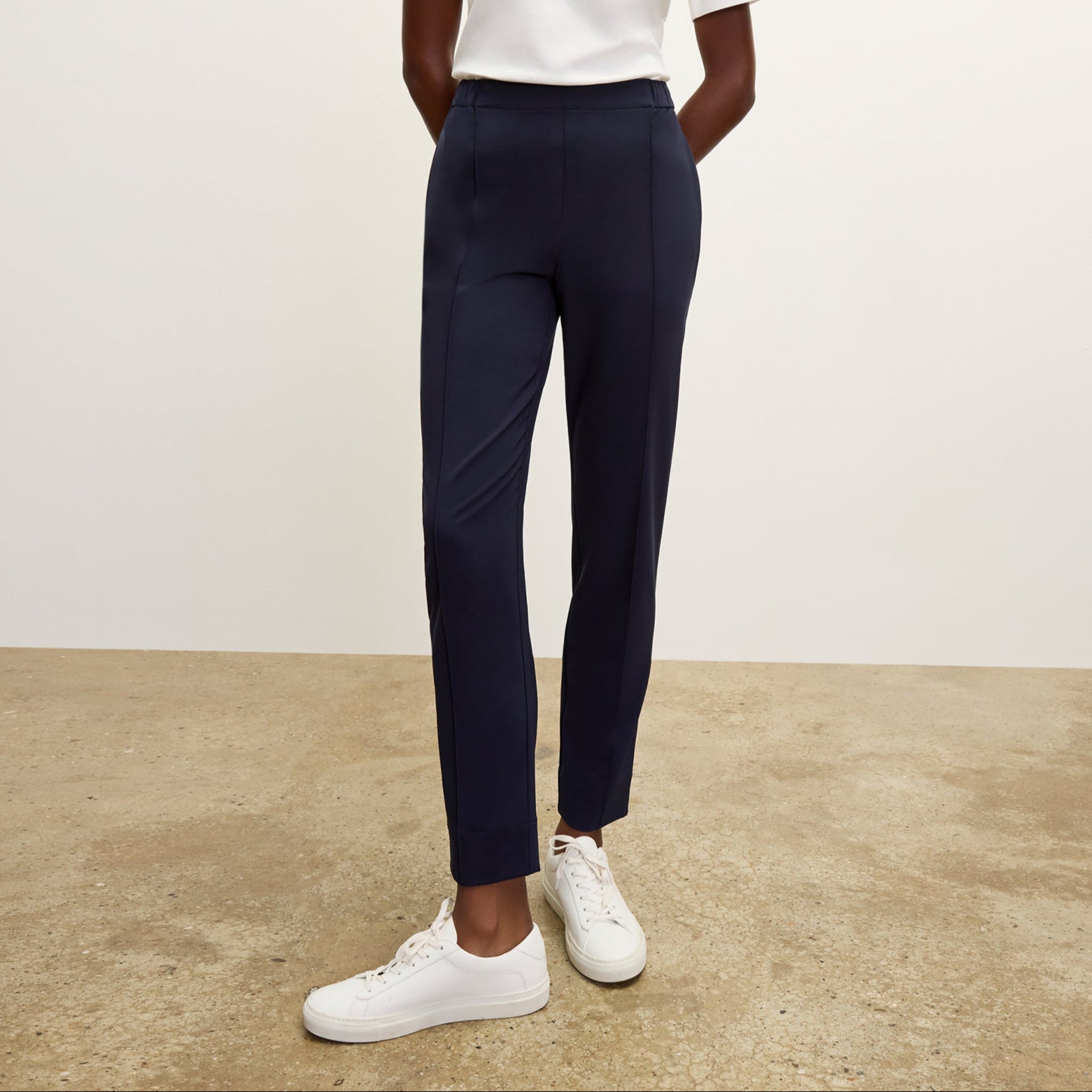 front image of a woman wearing the colby pants in dark navy 