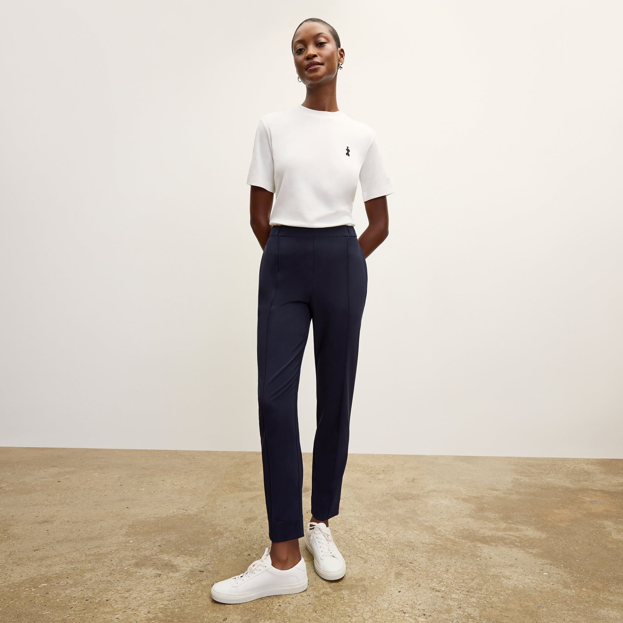 front image of a woman wearing the colby pants in dark navy