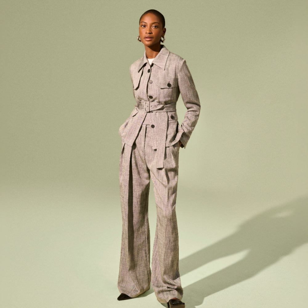 Front image of a woman wearing the emery jacket in Black/White Porto Weave
