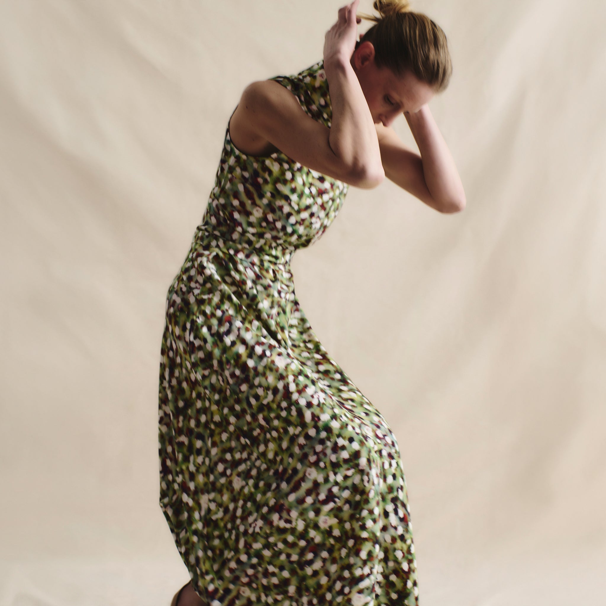 front image of a woman wearing the martina dress in spotlight print