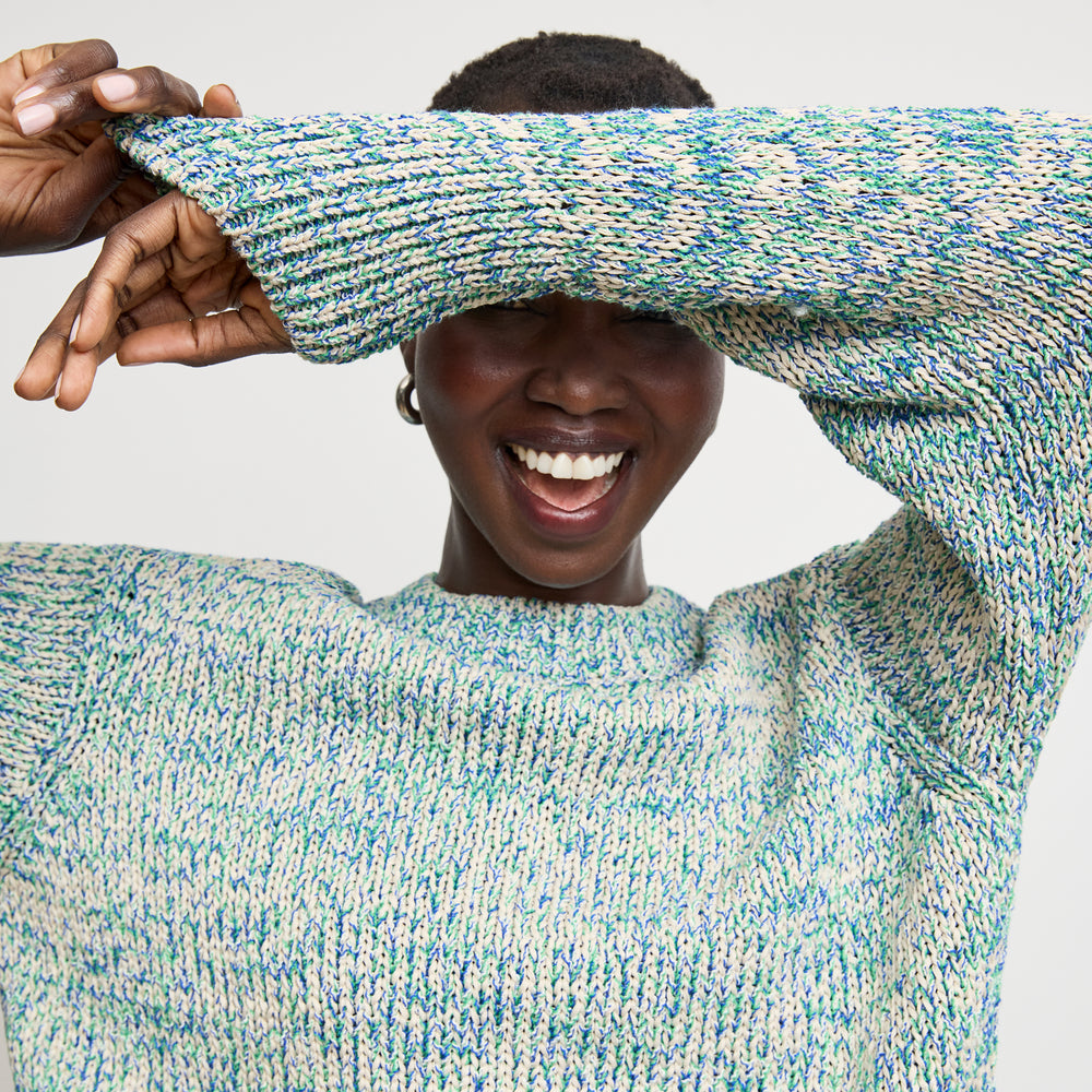 front image of a woman wearing the maura sweater in multi