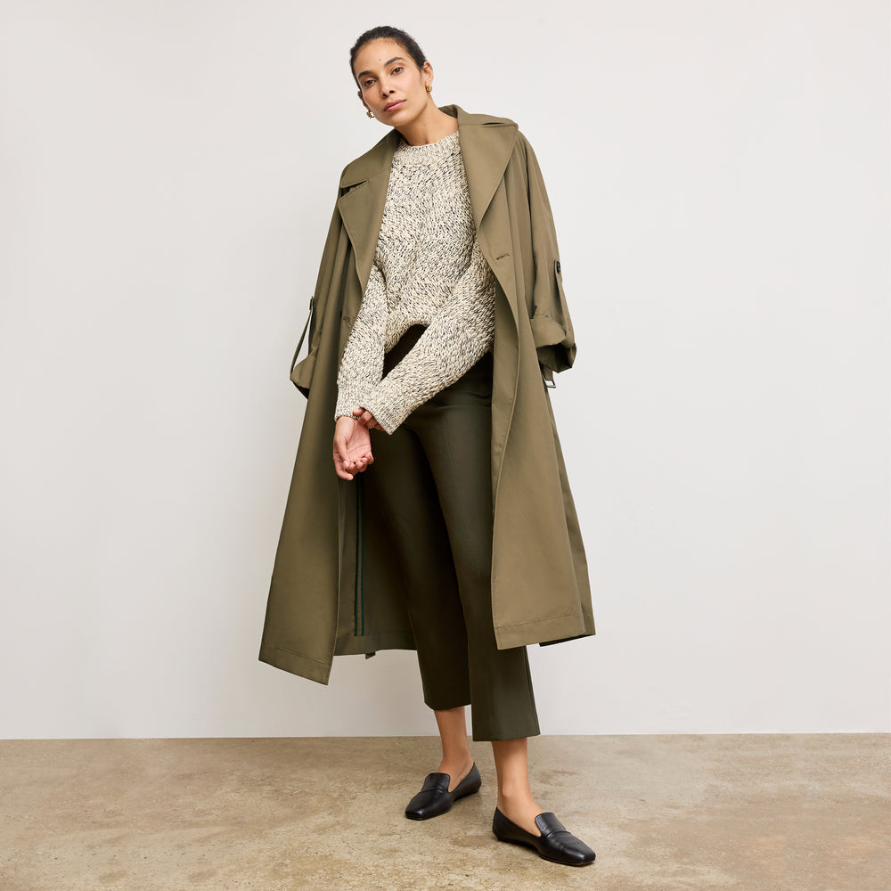 front image of a woman wearing the kick flare foster pants in olive