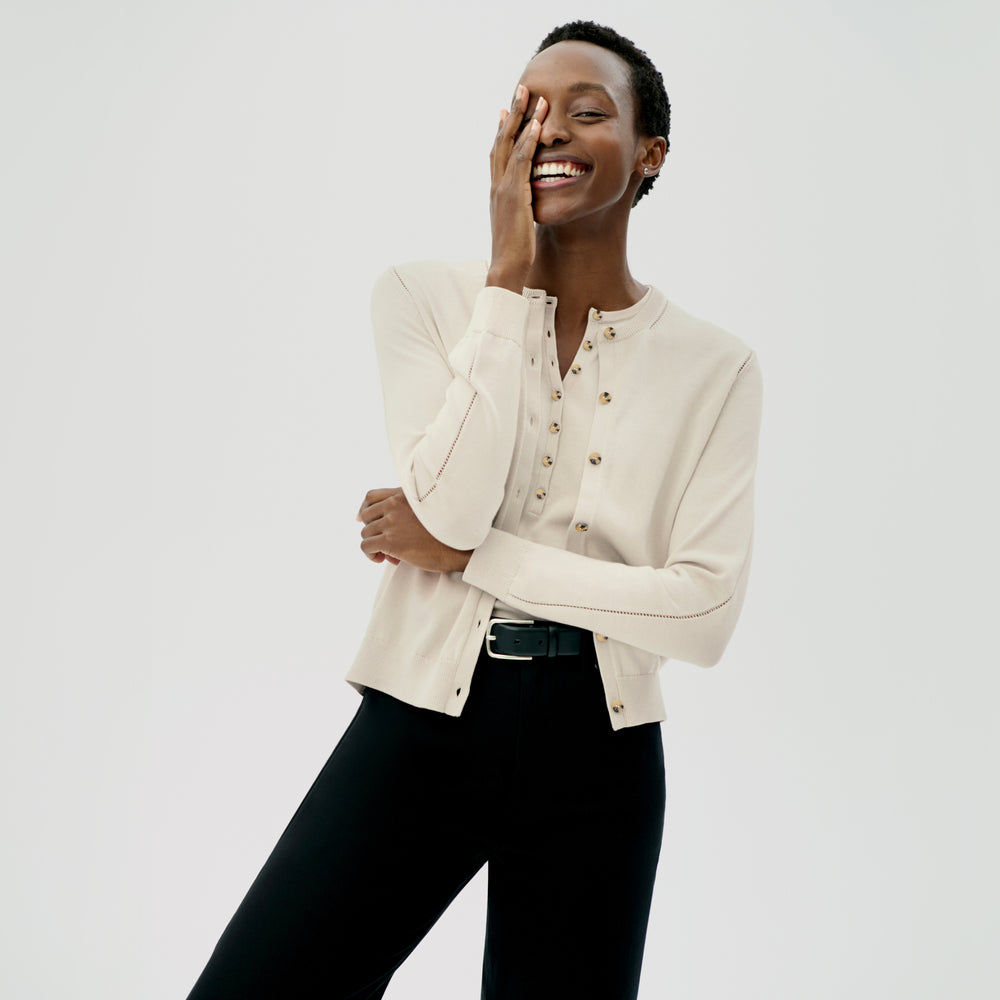 front image of a woman wearing the crimmins top in ivory