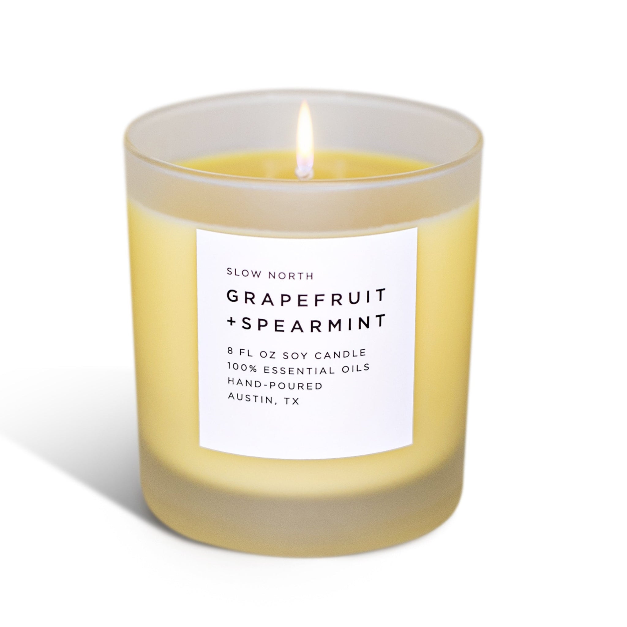Grapefruit and spearmint candle with a label on a white background 