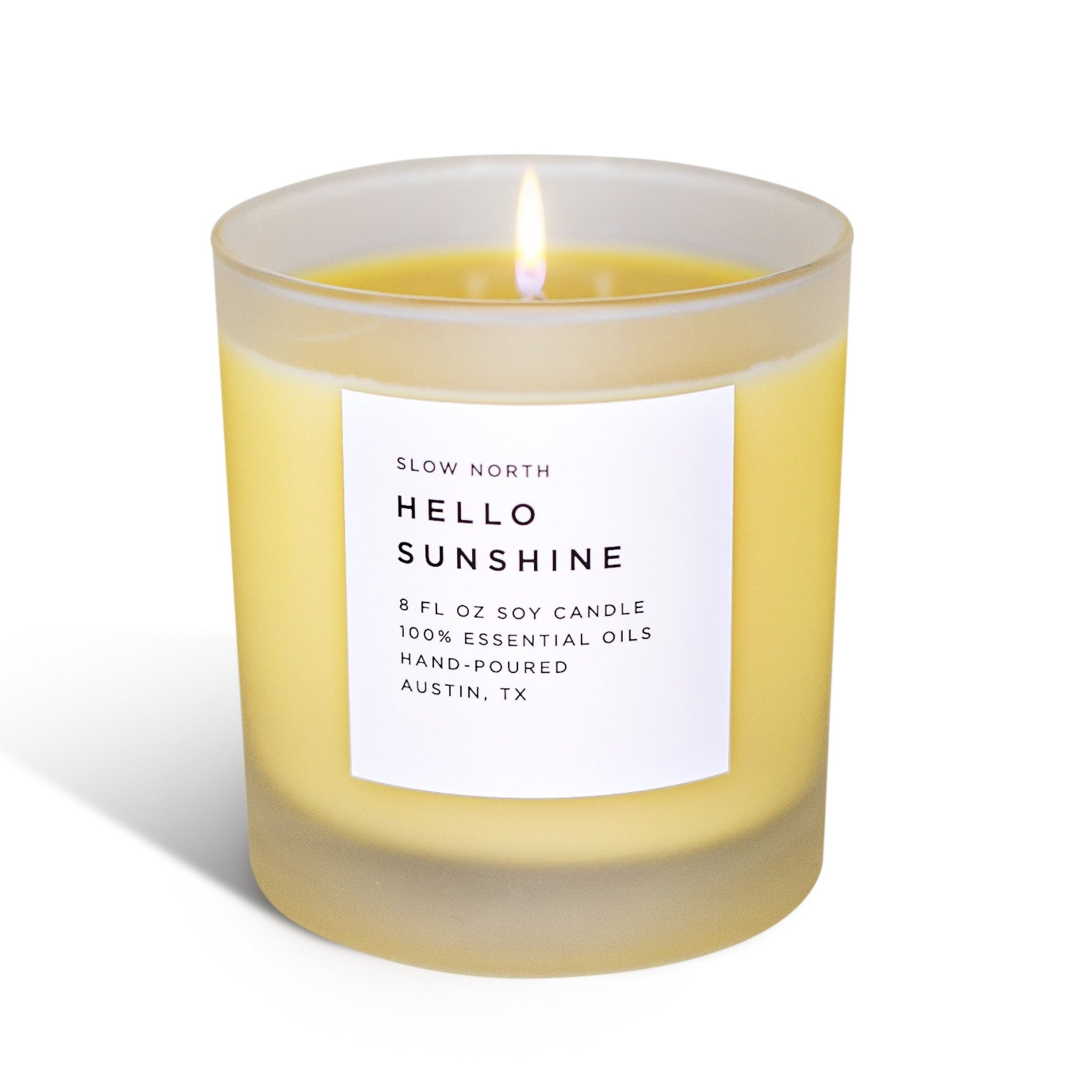 Candle labeled 'Hello Sunshine' by Slow North on a white background 