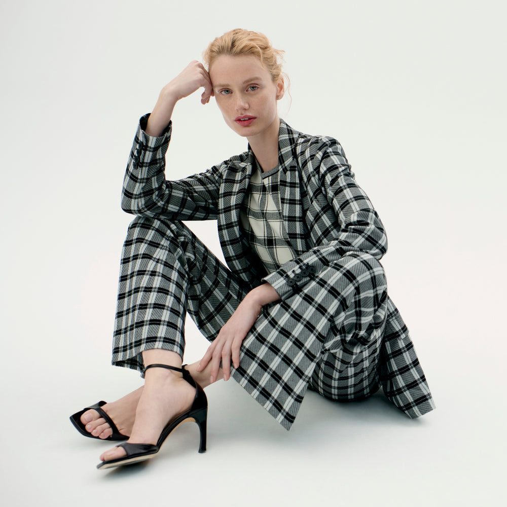 Front image of a woman wearing the horton pants in checkmate