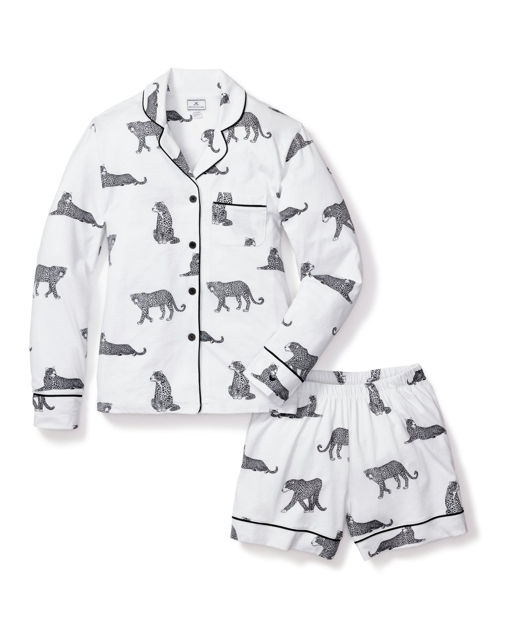 White pajama set with black animal prints on a white background 