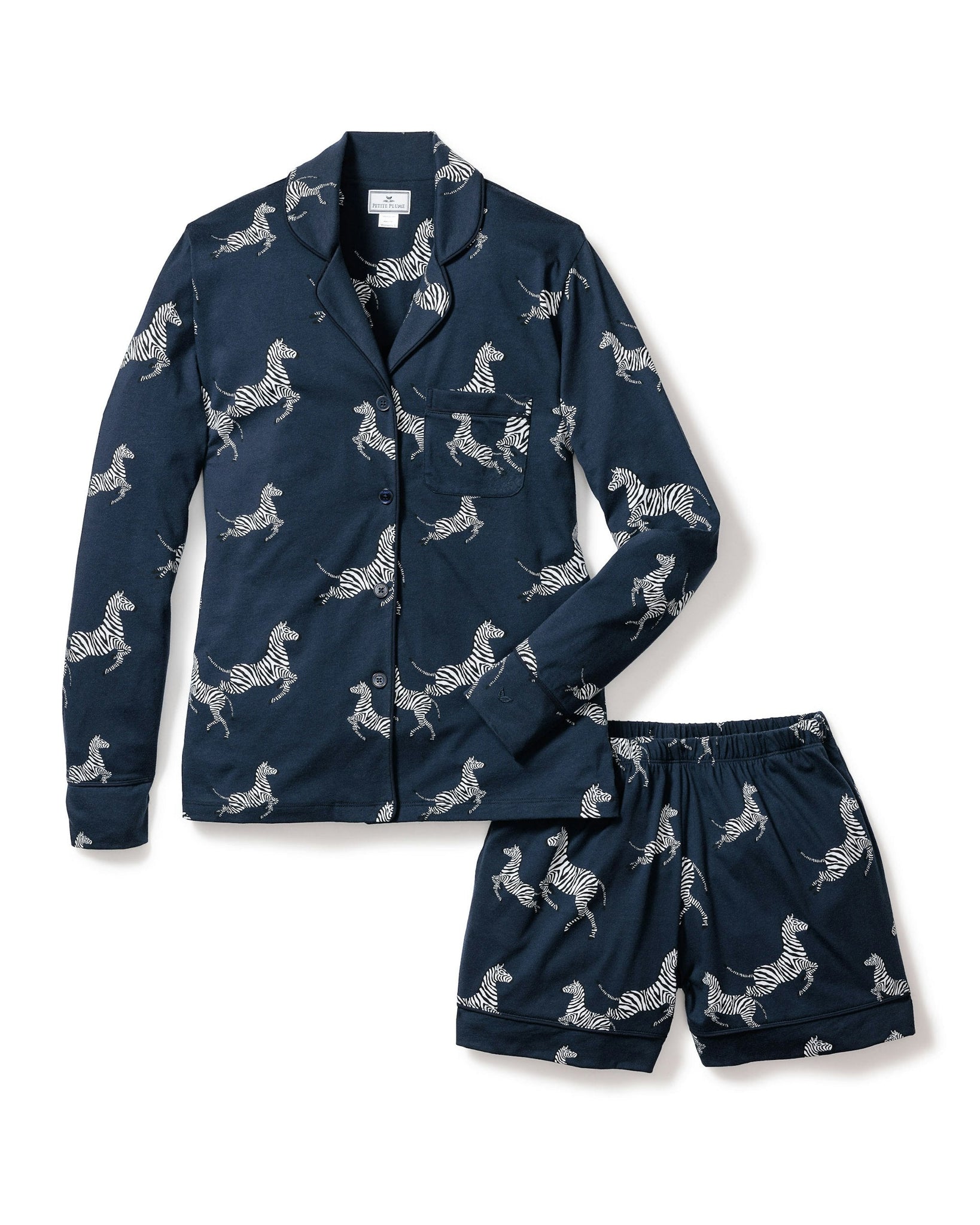 Navy pajama set with zebra pattern on a white background
