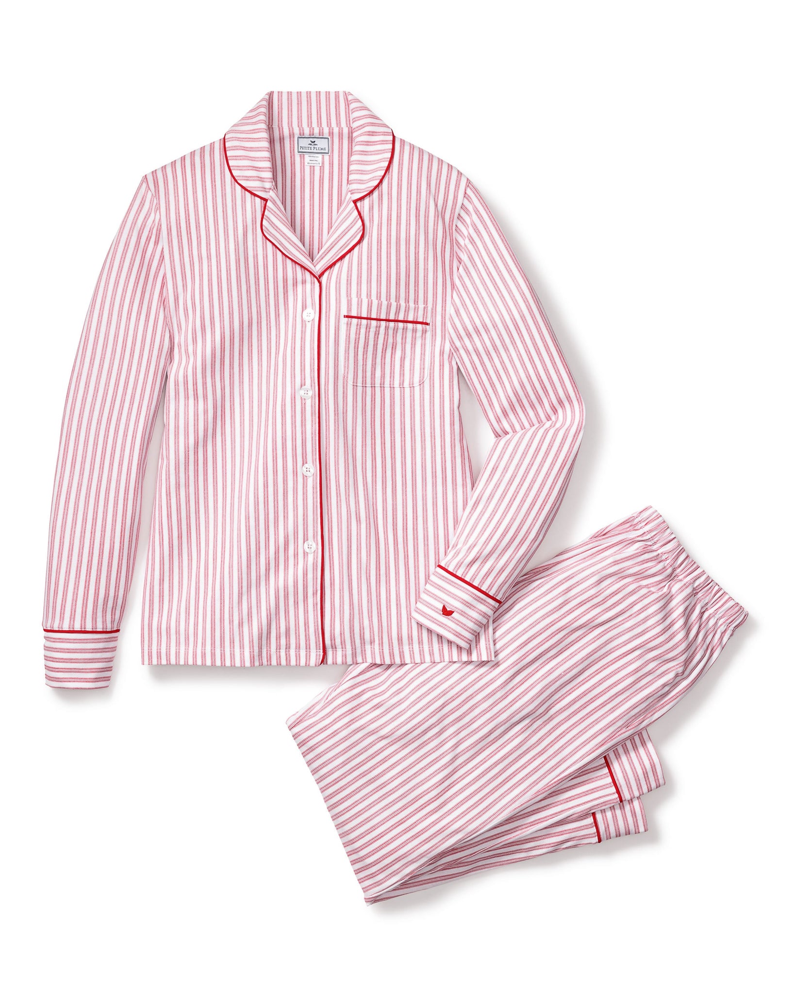 Pink and white striped pajama set on a white background 