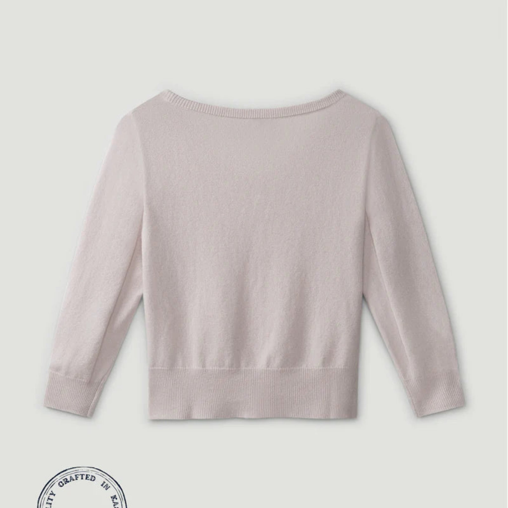 Light purple sweater on a light gray background