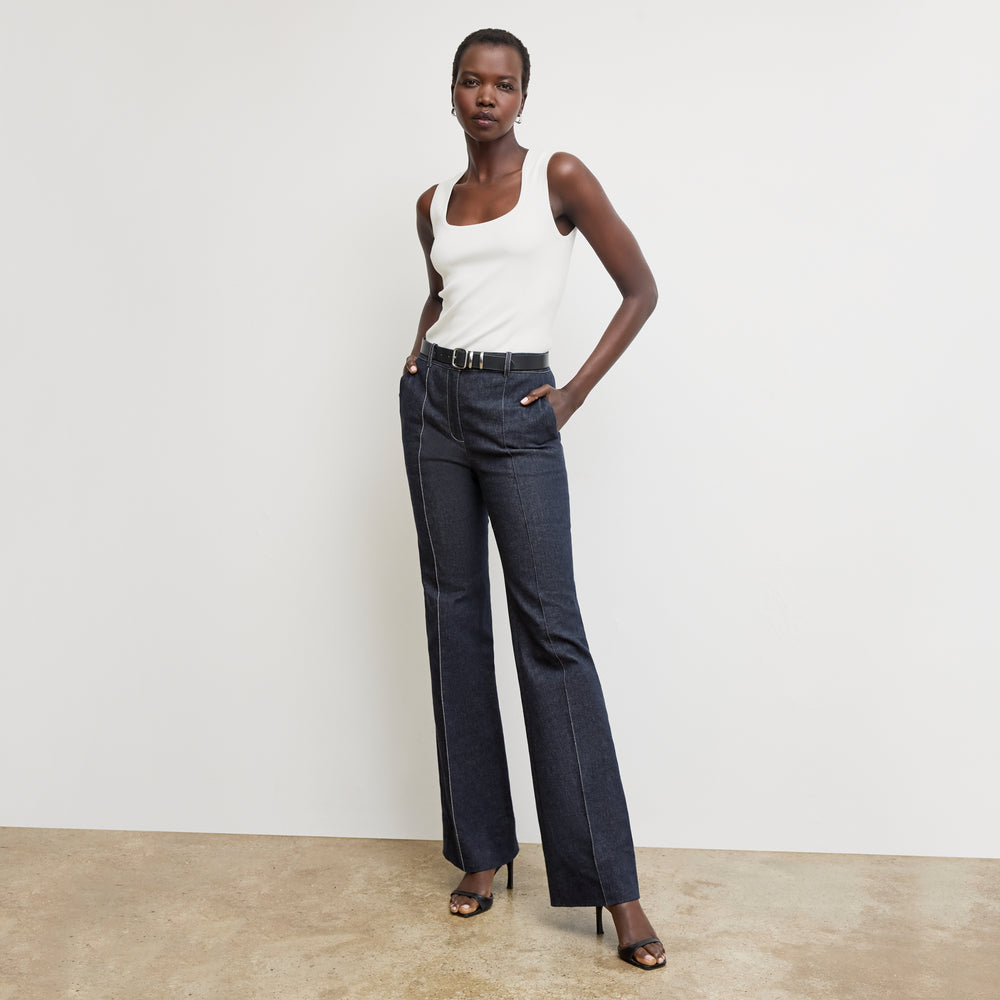front image of a woman wearing the sabine top in ivory