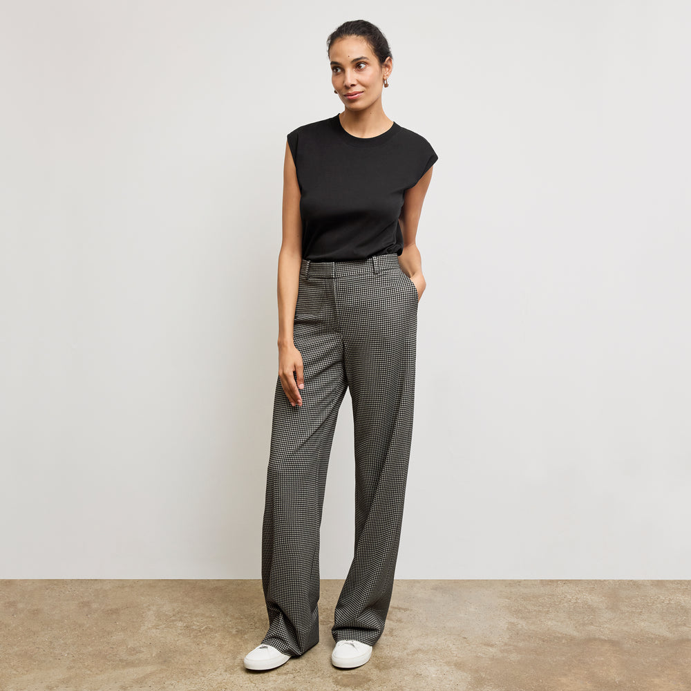 Front image of a woman standing wearing the alina top in compact cotton in black