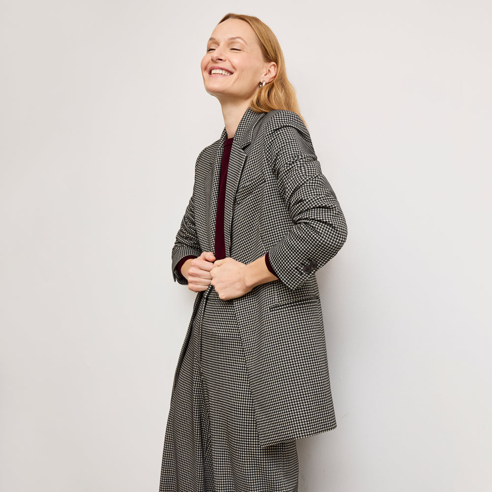 front image of a woman wearing the rossi blazer in classic check