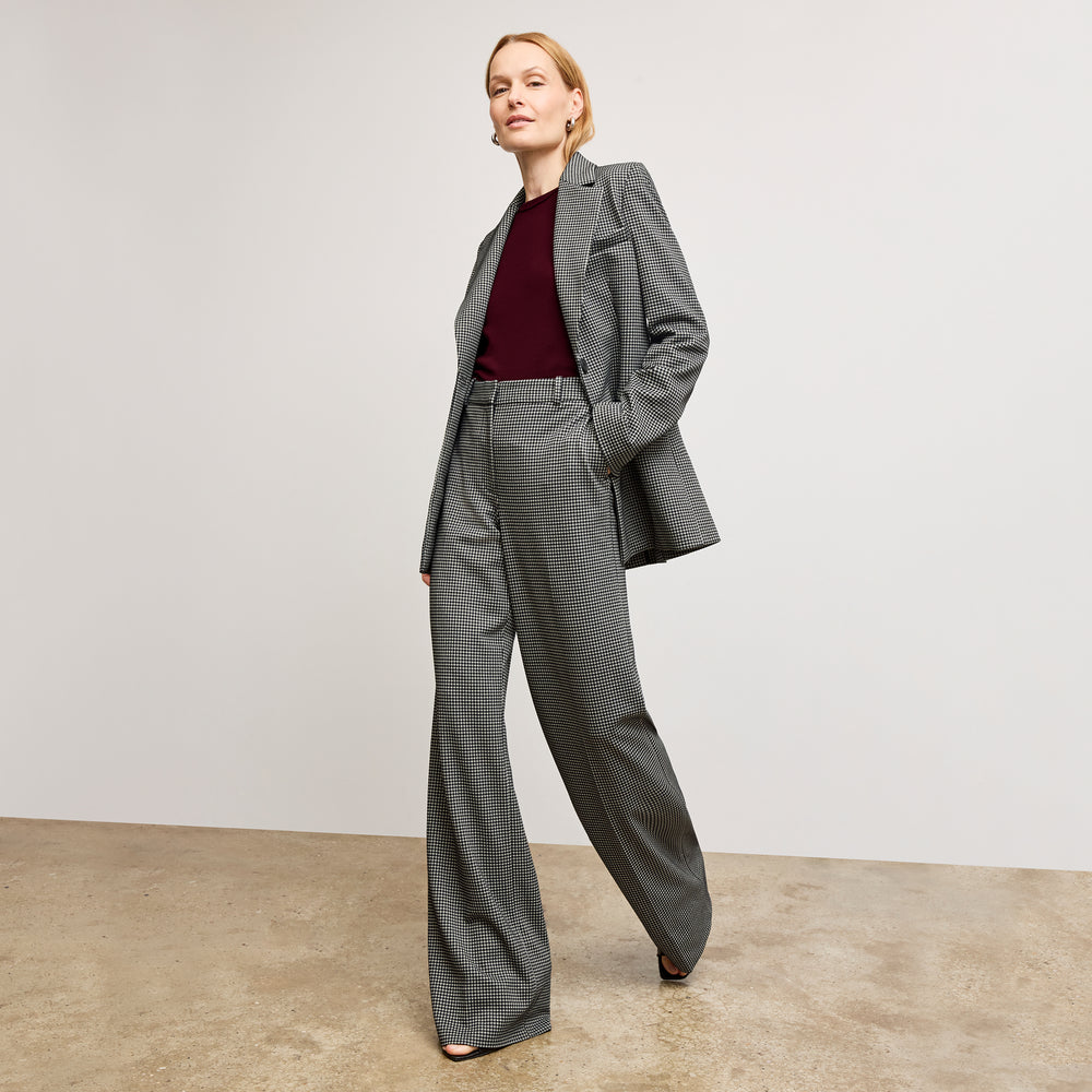 front image of a woman wearing the rossi blazer in classic check