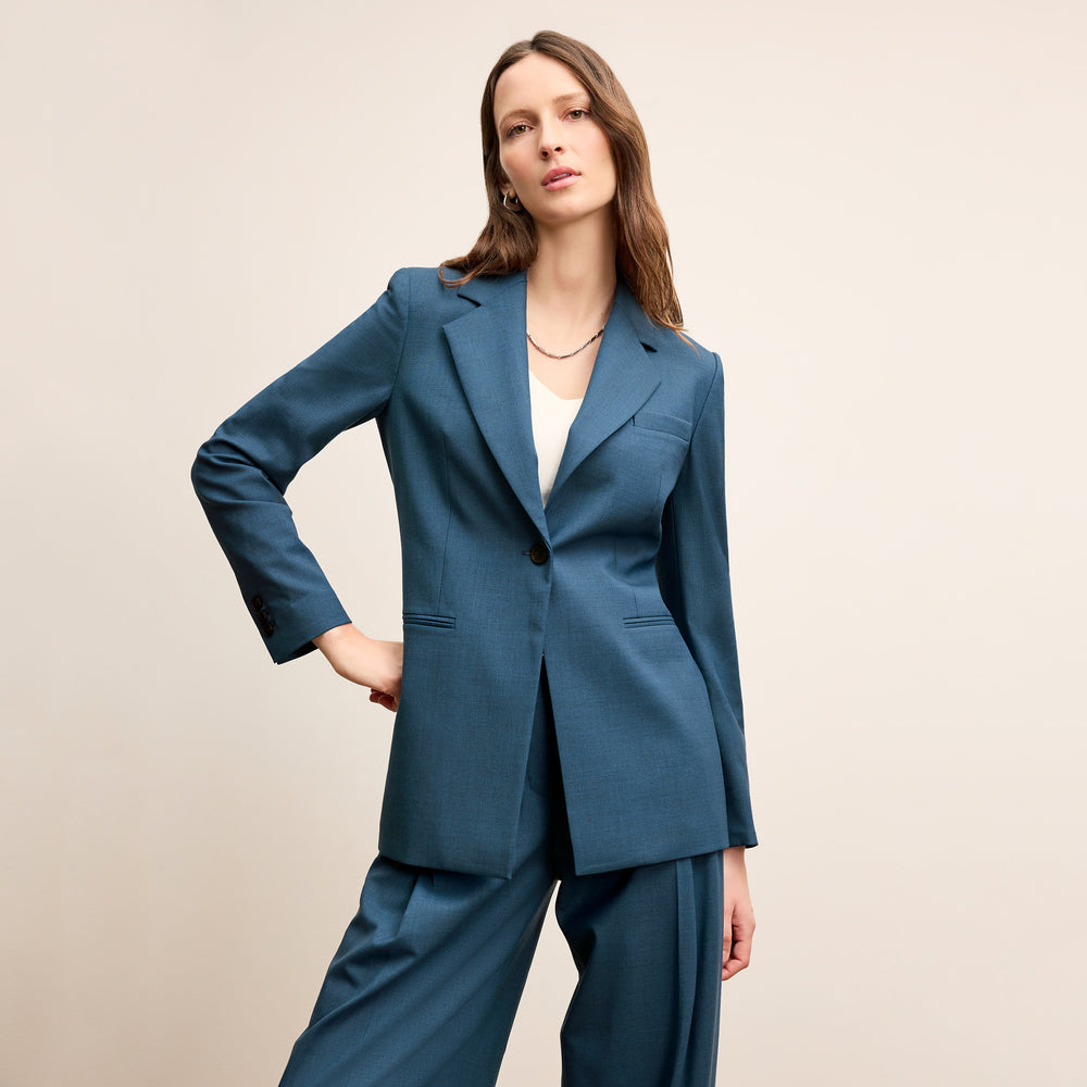 front image of a woman wearing the rossi jacket in bluebell