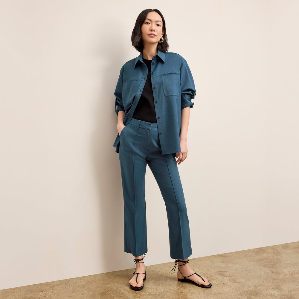 front image of a woman wearing the tessa pant in bluebell