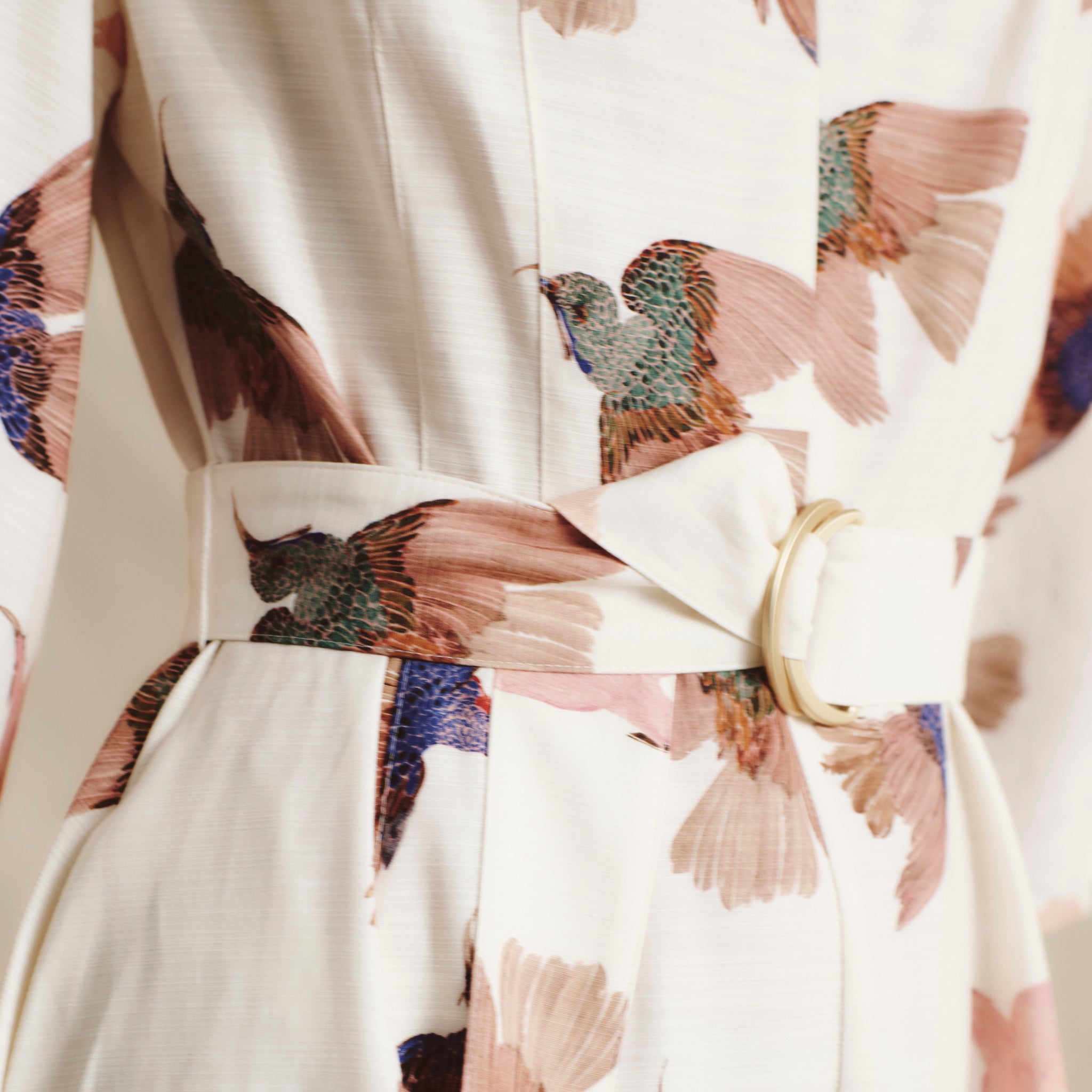 front image of a woman wearing the tessie dress in hummingbird print