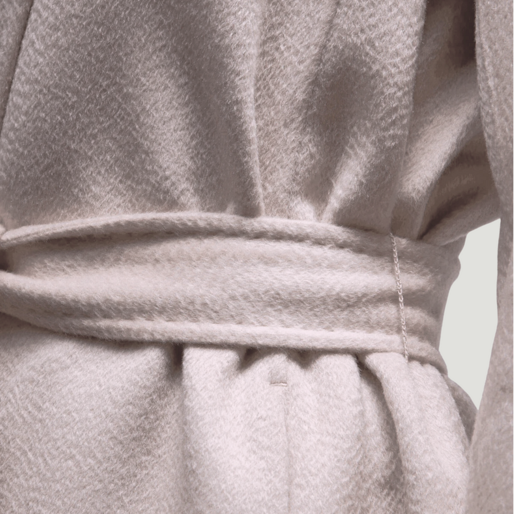 Close-up of a textured beige fabric with a belt