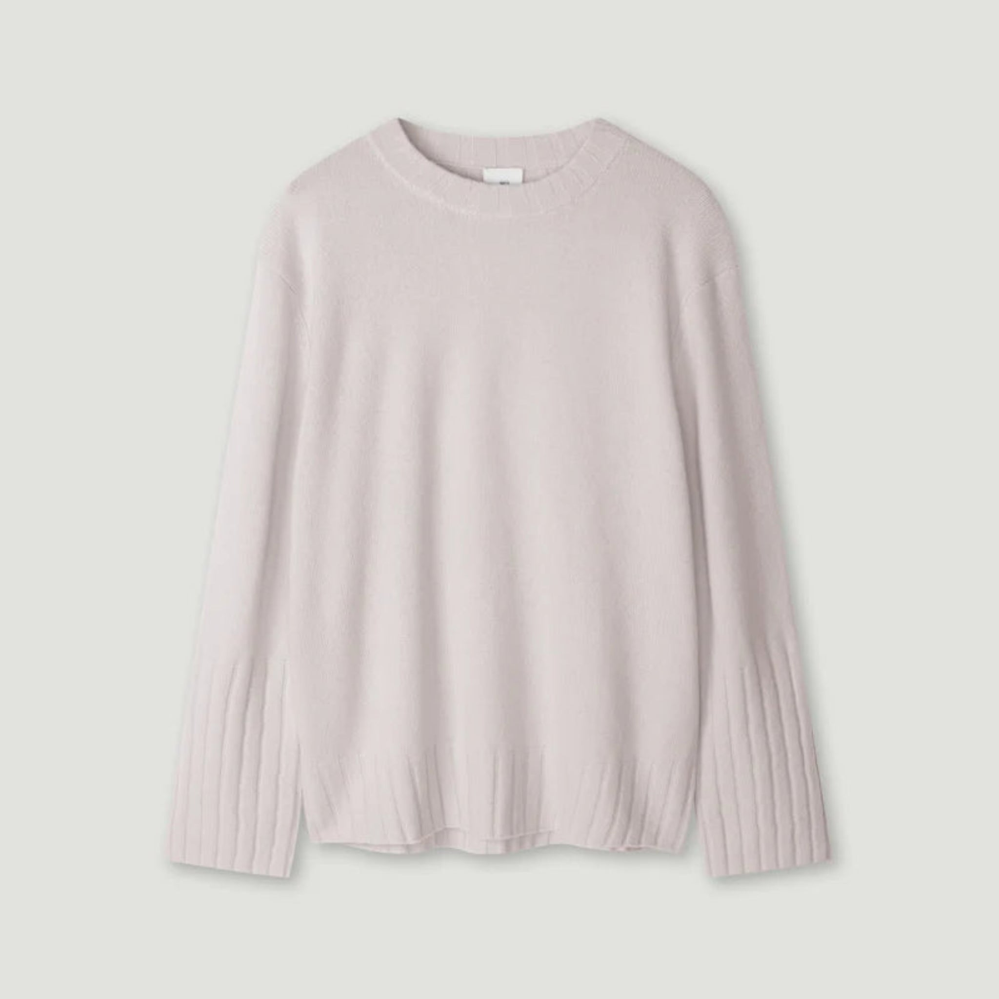 Light pink sweater on a light gray background 