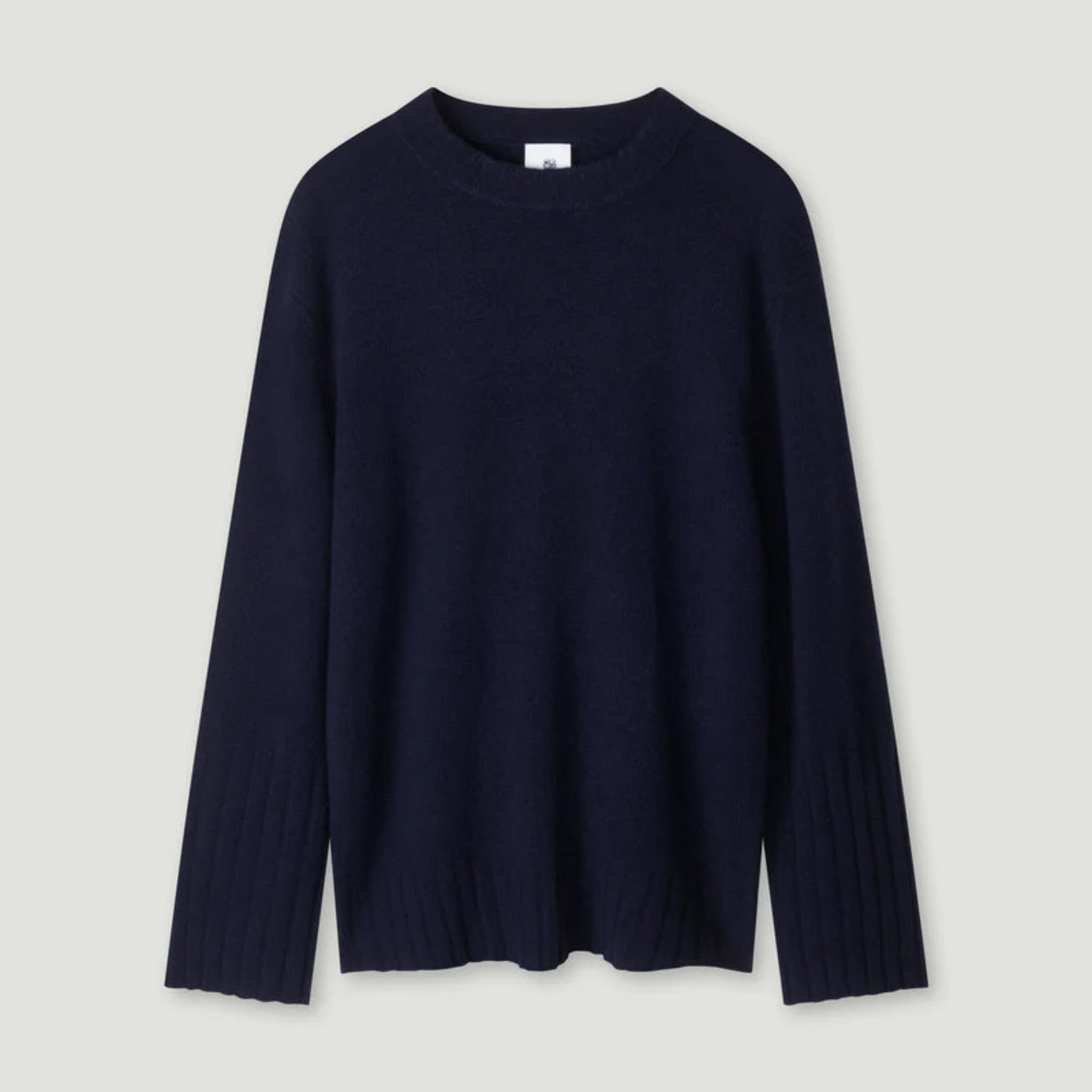 Navy blue sweater on a light gray background 