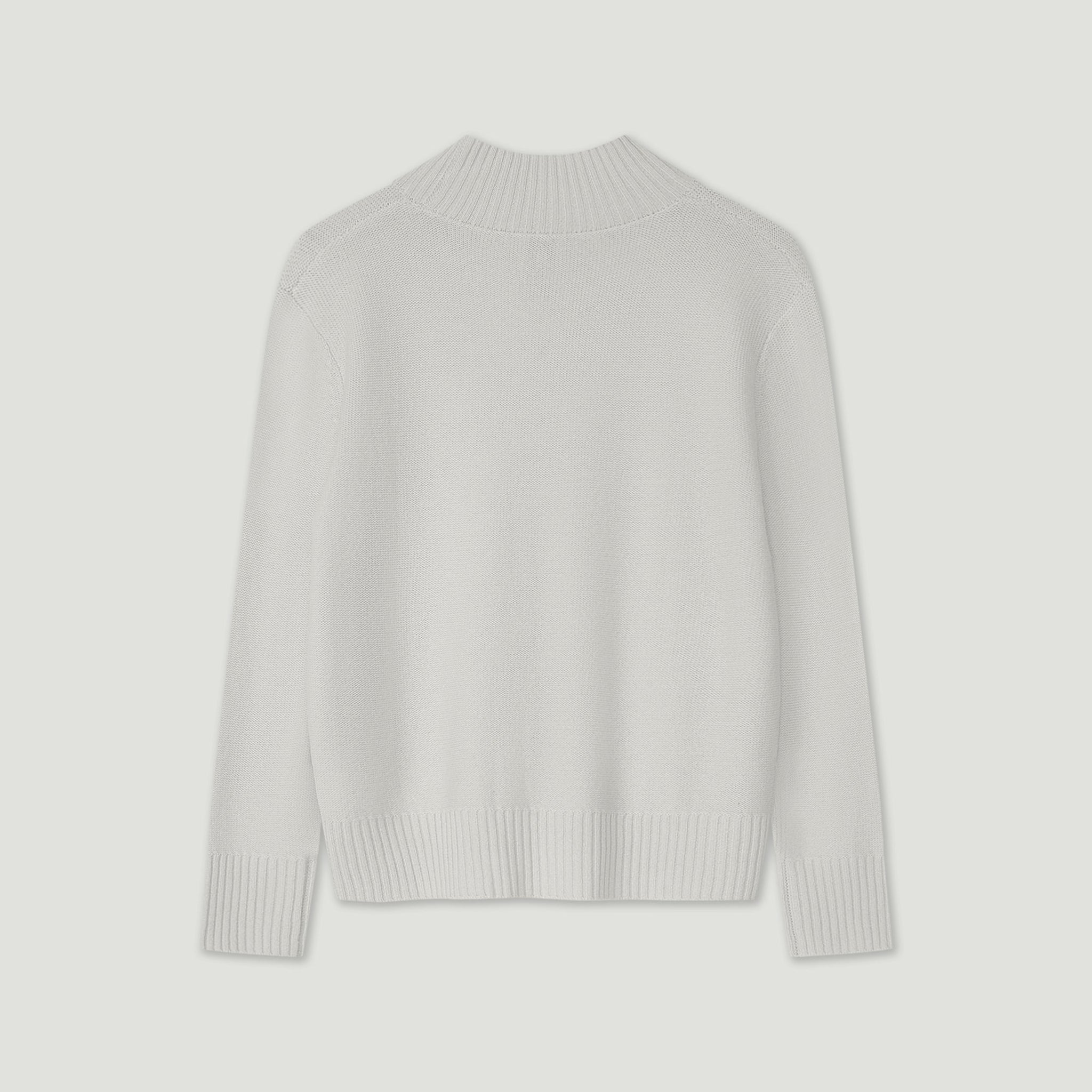 Light gray sweater on a light gray background