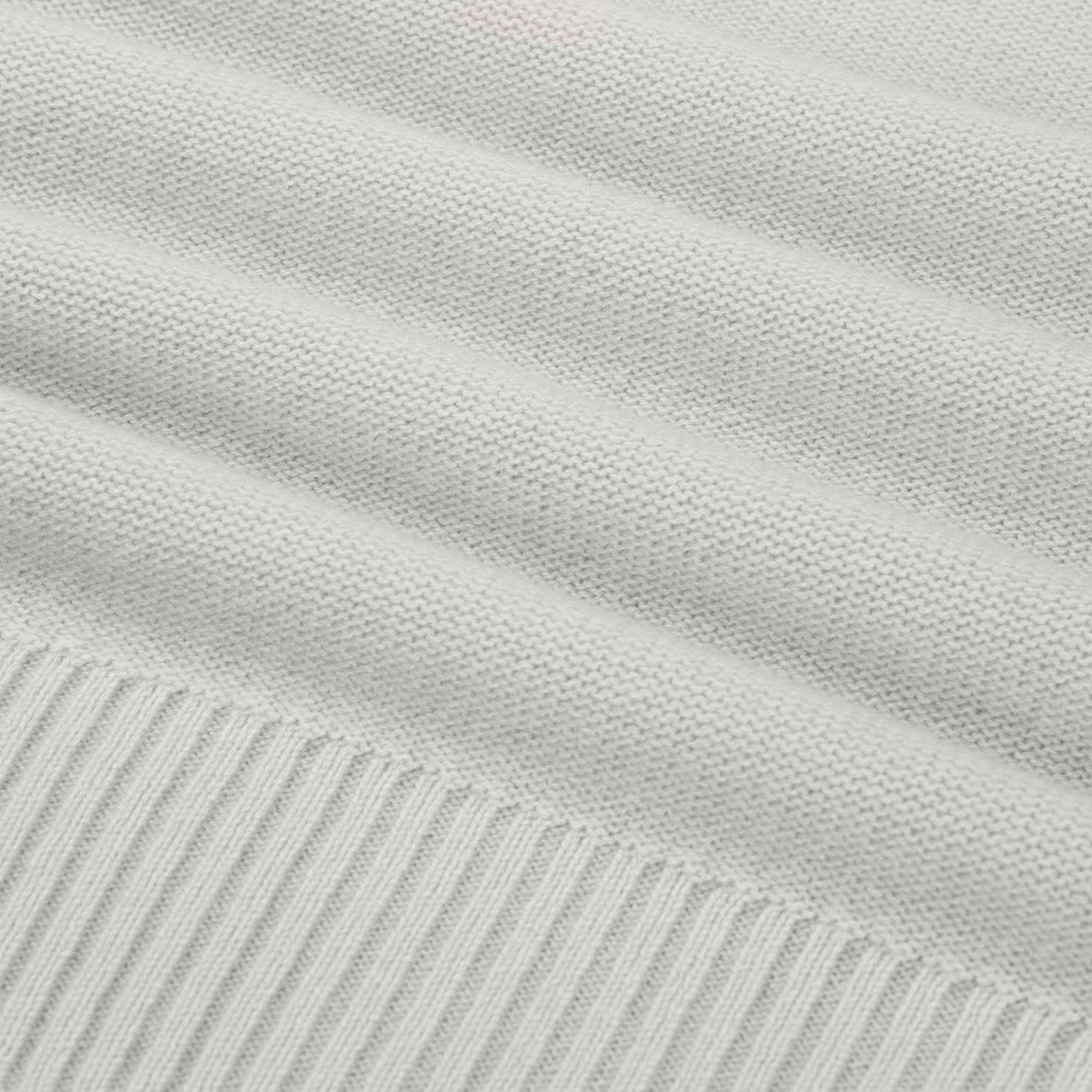 Close-up of light gray fabric with subtle texture and stripes.