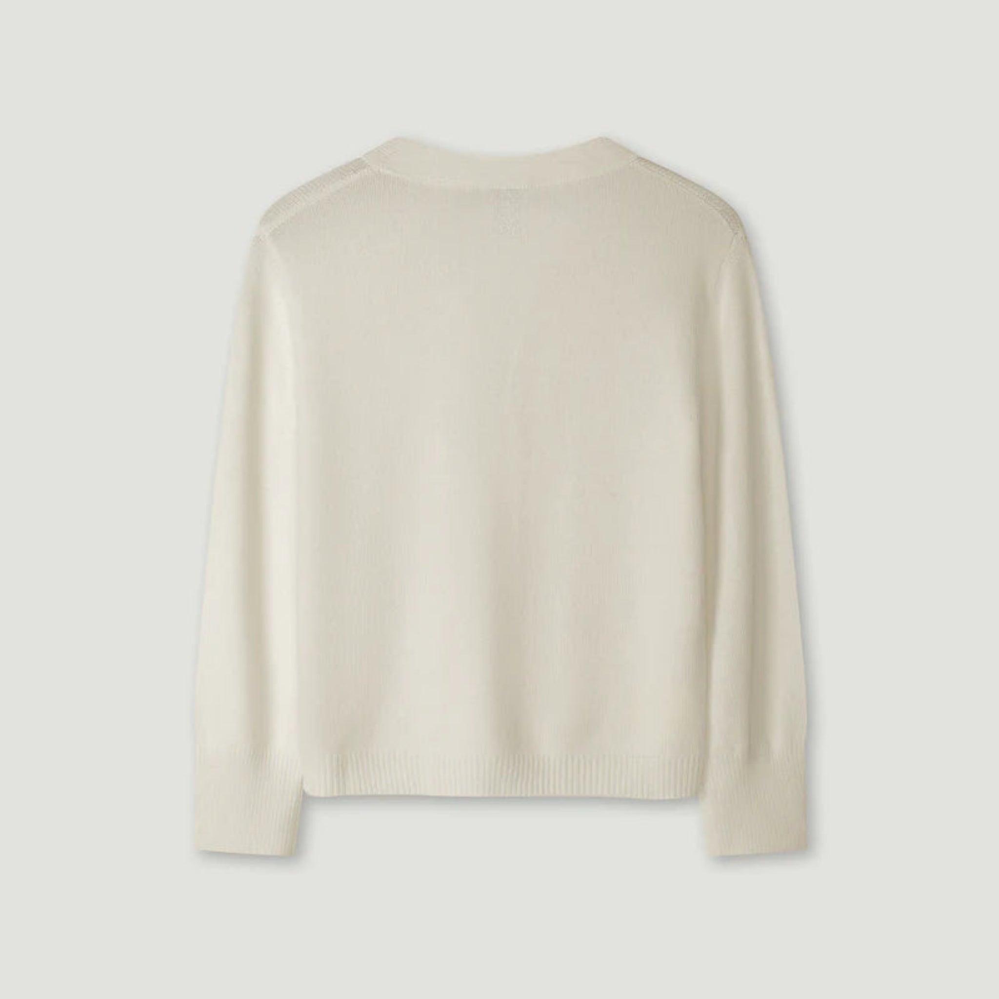 Beige sweater on a light gray background