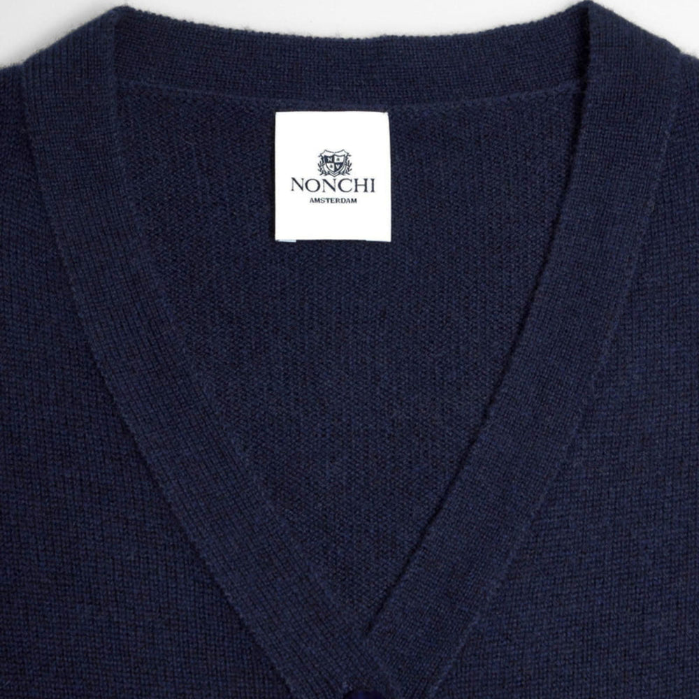 Navy blue cardigan with a Nonchi label on a white background