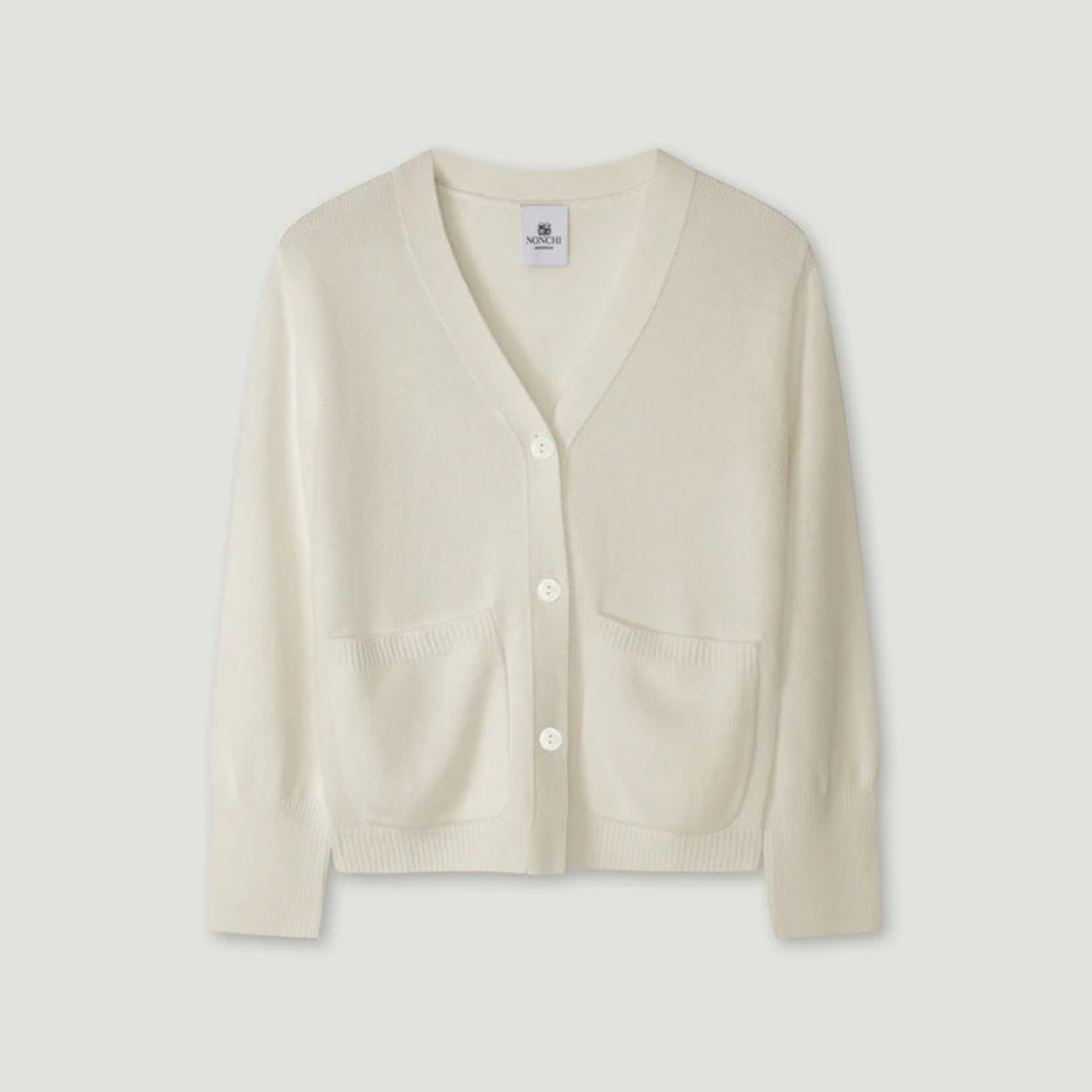 Beige cardigan on a light gray background 