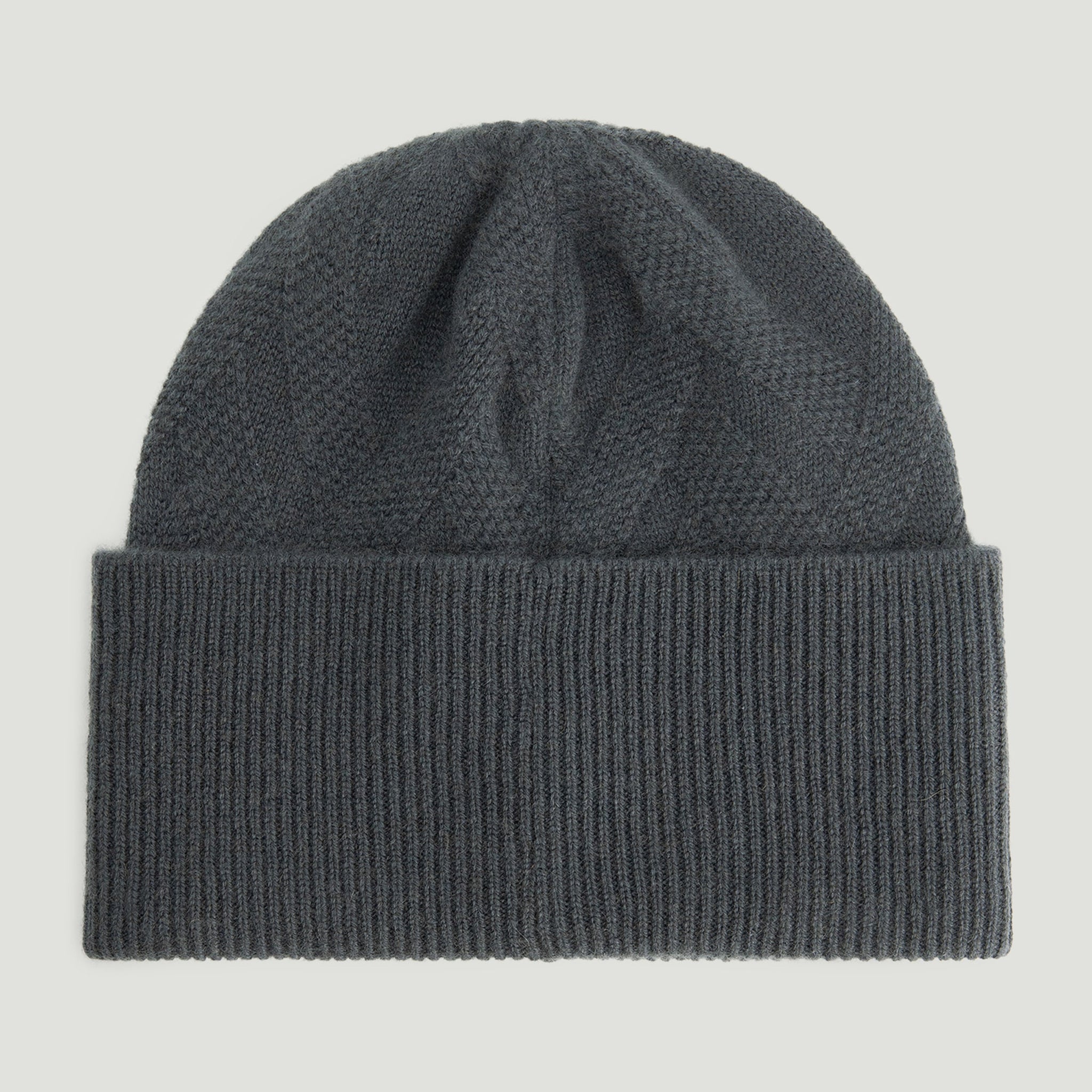 Dark gray knit beanie on a light gray background