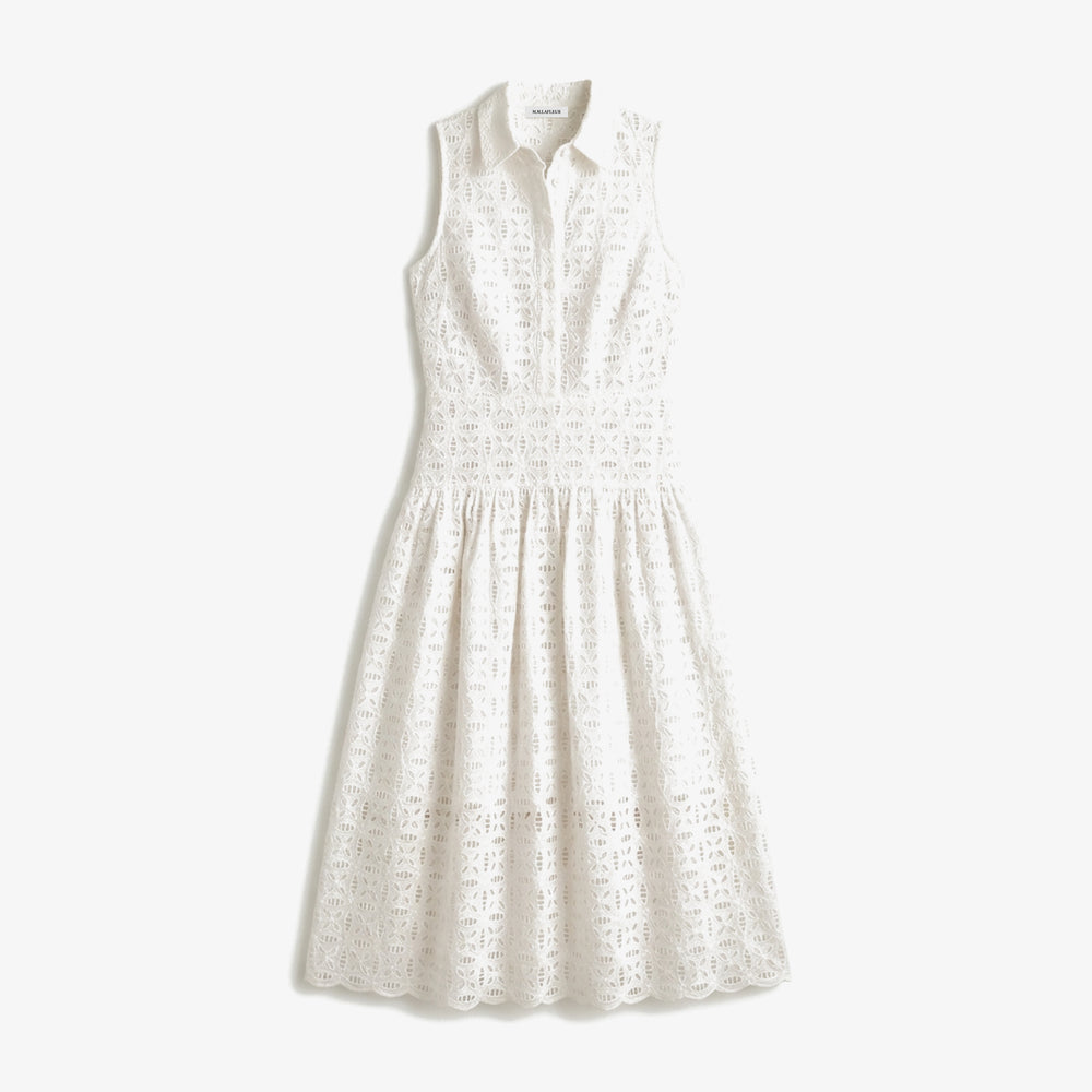 White sleeveless dress with lace details on a white background