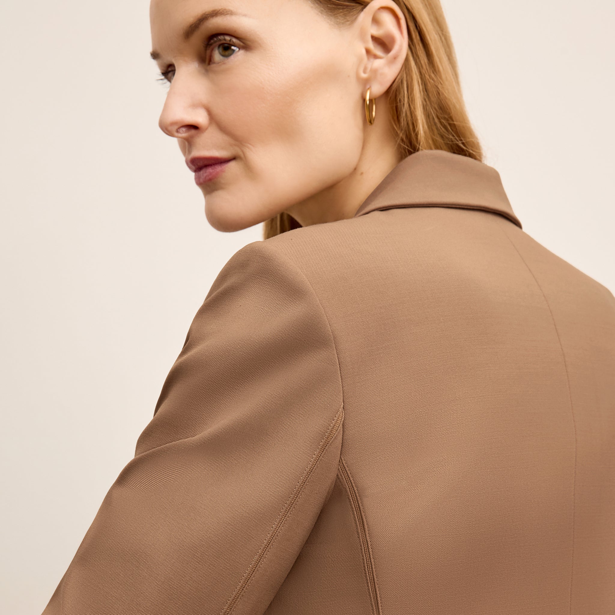 detail image of a woman wearing the yasmine jacket in saddle