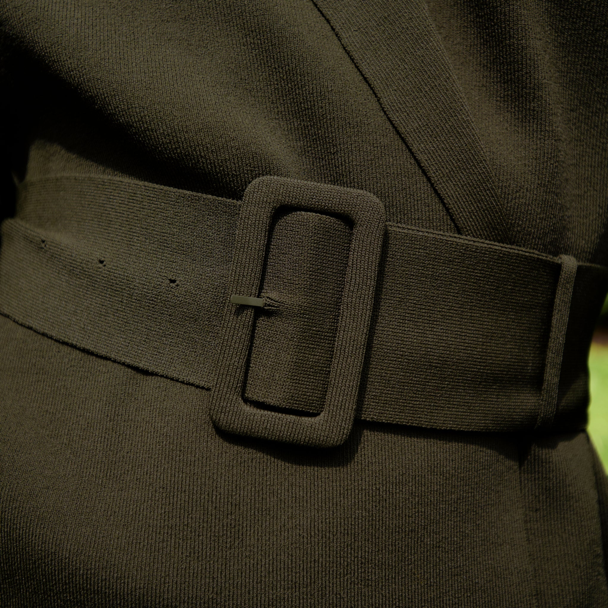 front image of a woman wearing the yuwei jardigan in dark elm