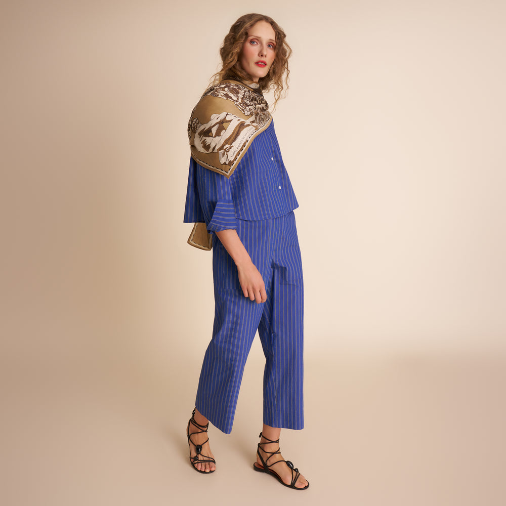 woman in blue stripped pants