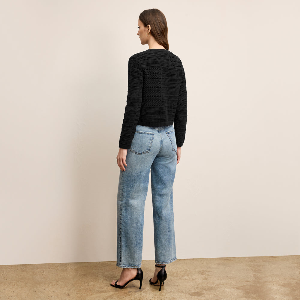 back image of a woman wearing the zosia cardigan in black