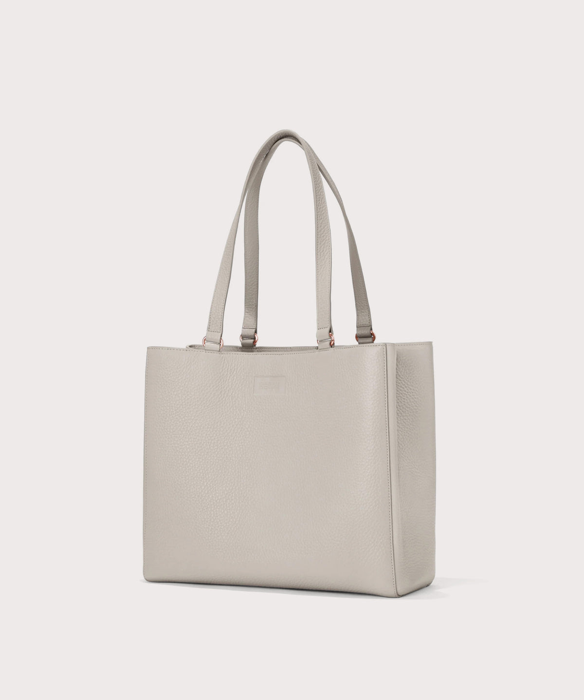 Beige tote bag on a light gray background