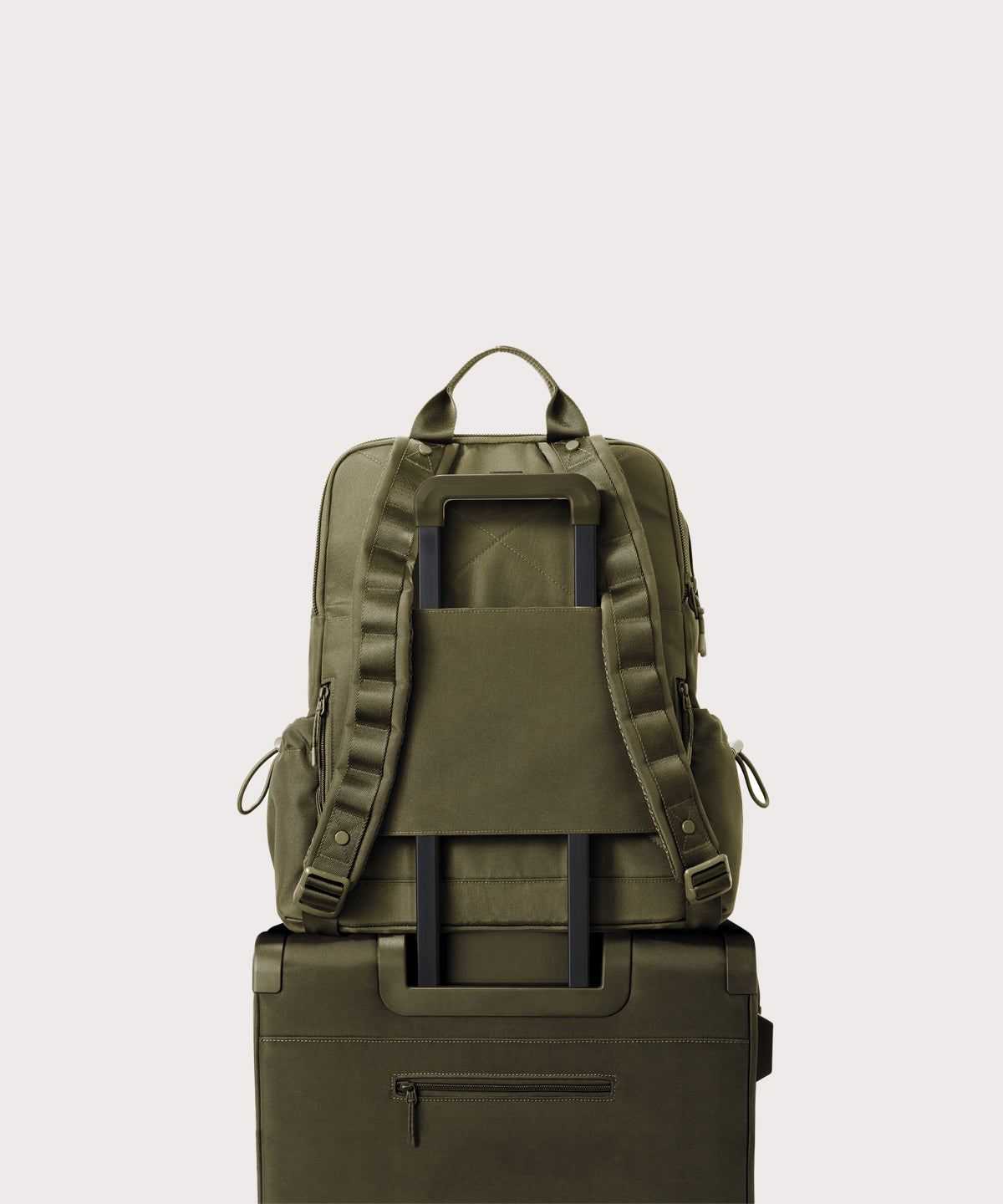 Green backpack on a beige background