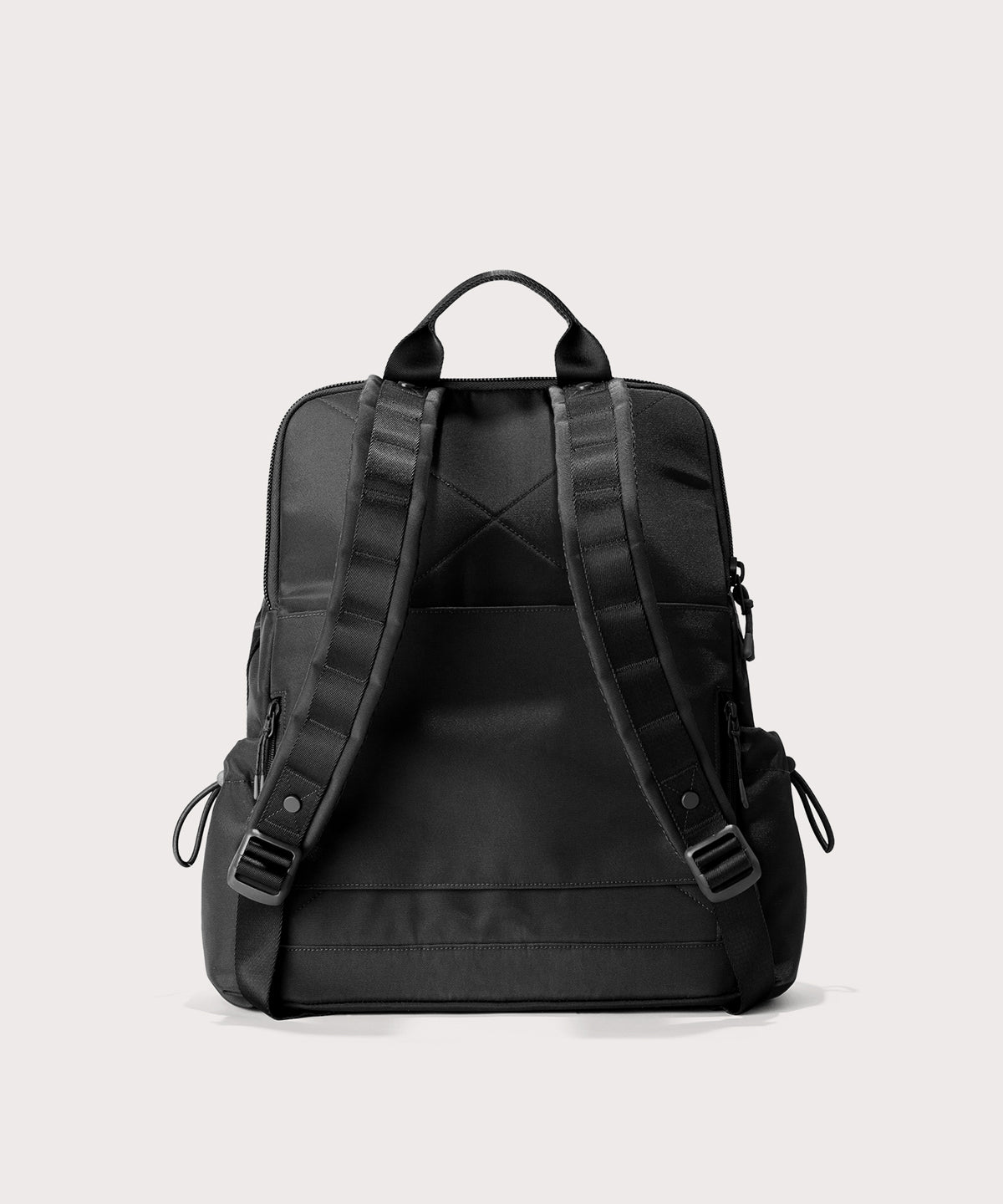Black backpack on a light gray background