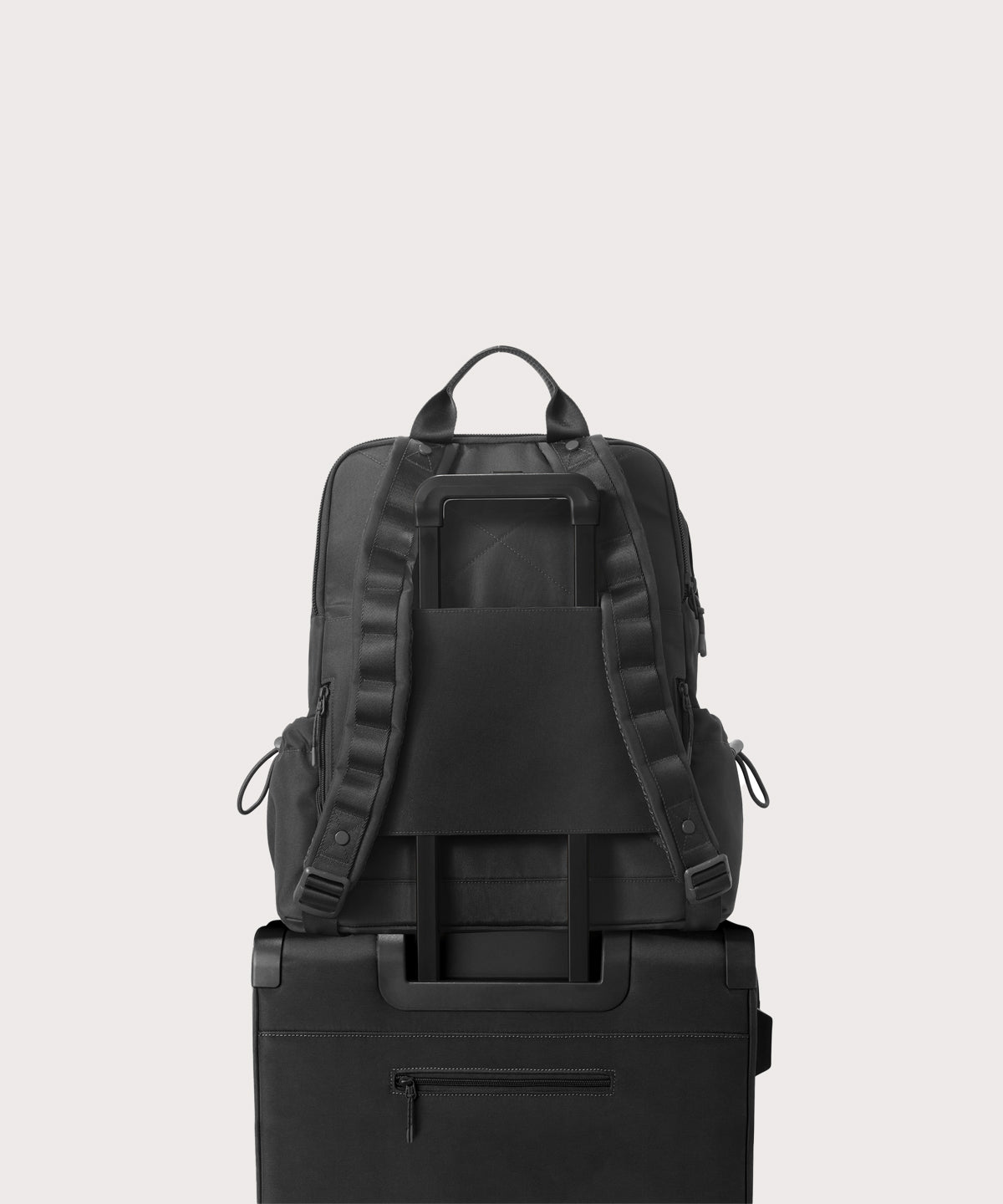 Black backpack on a light gray background
