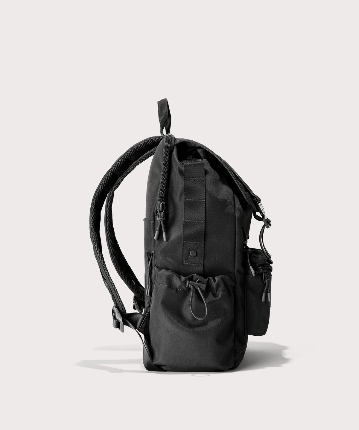 Black backpack on a light gray background