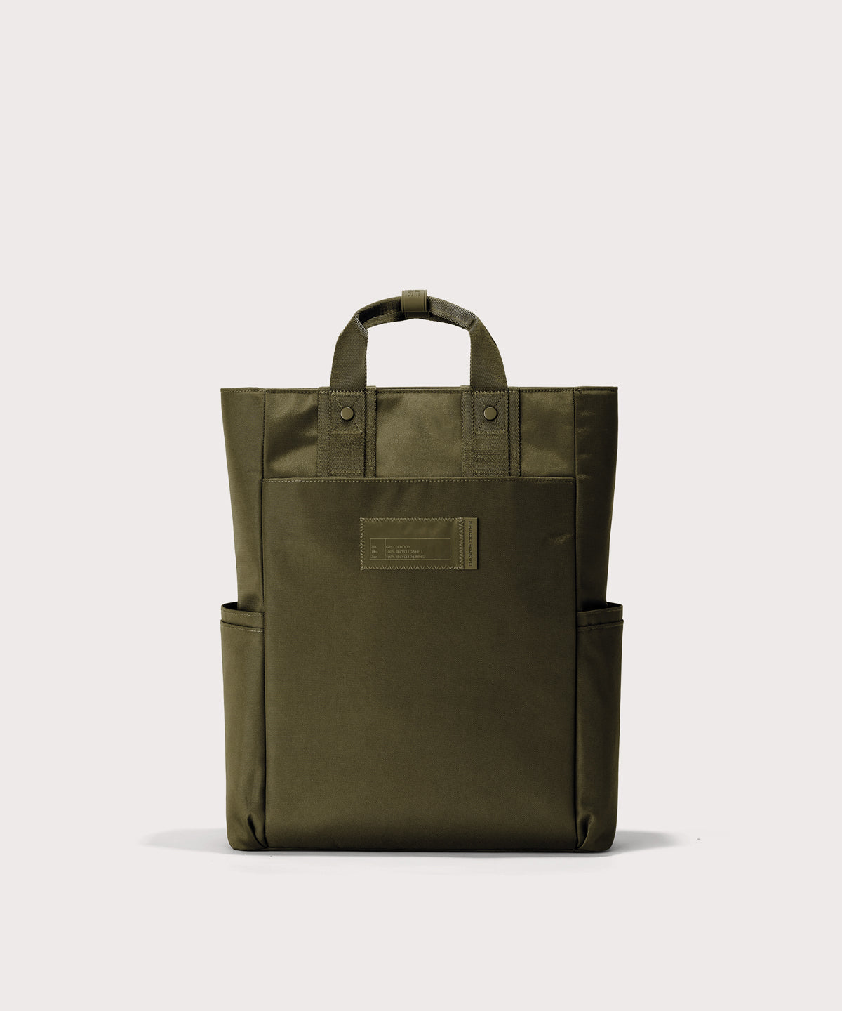 Green tote bag with a patch on a white background 