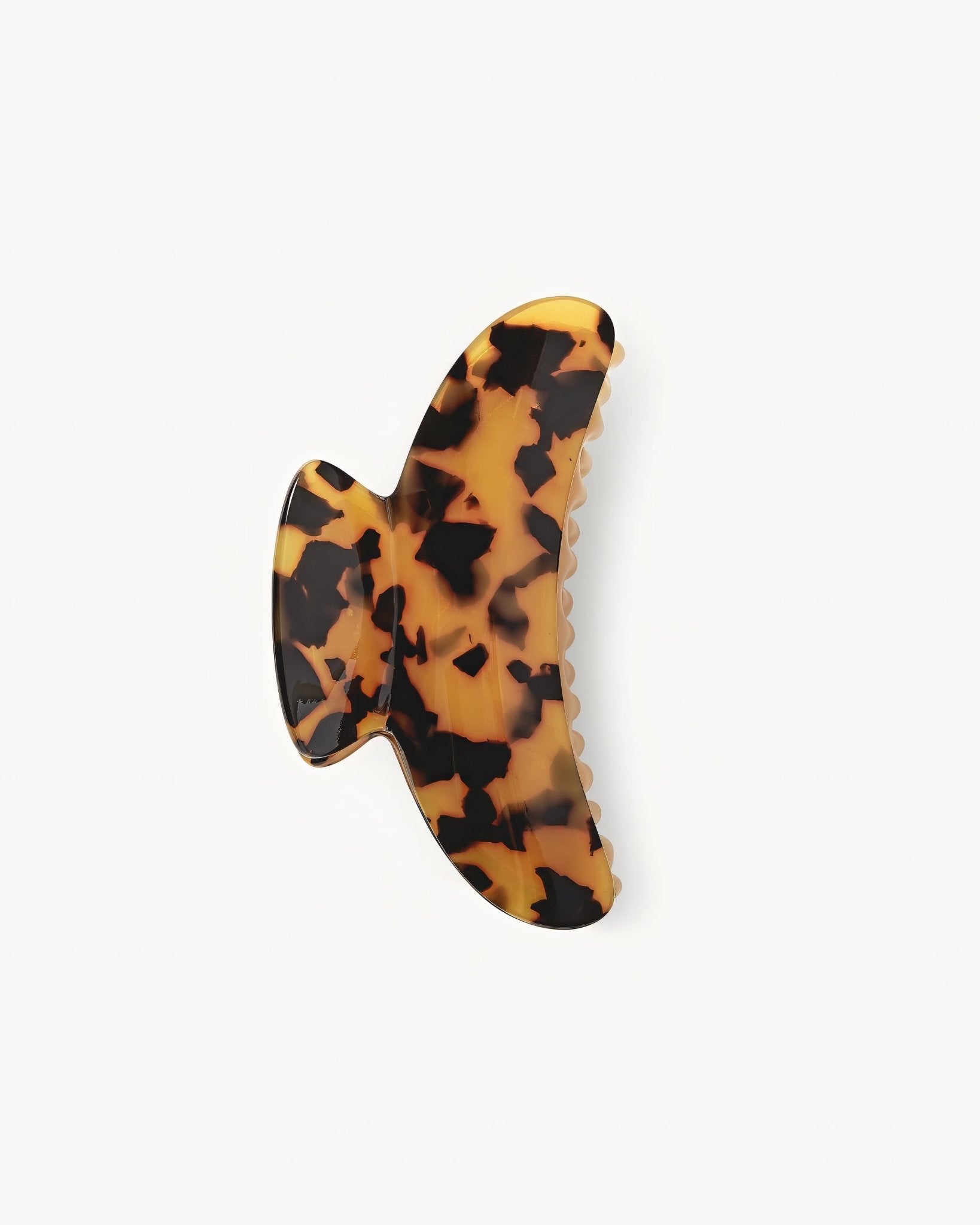 Tortoiseshell hair clip on a white background 